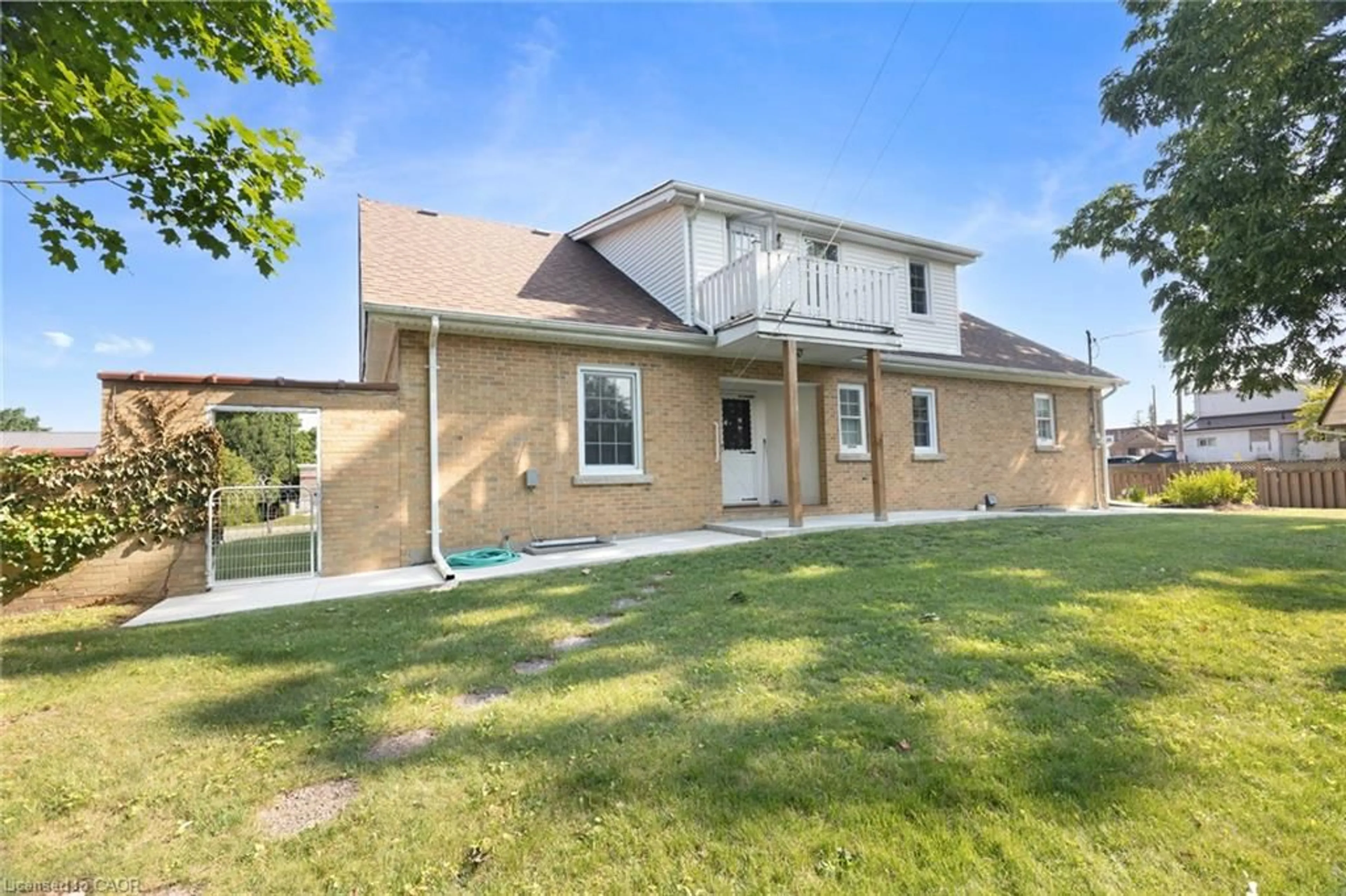 Home with vinyl exterior material, street for 24 Pine St, Delhi Ontario N4B 1N6