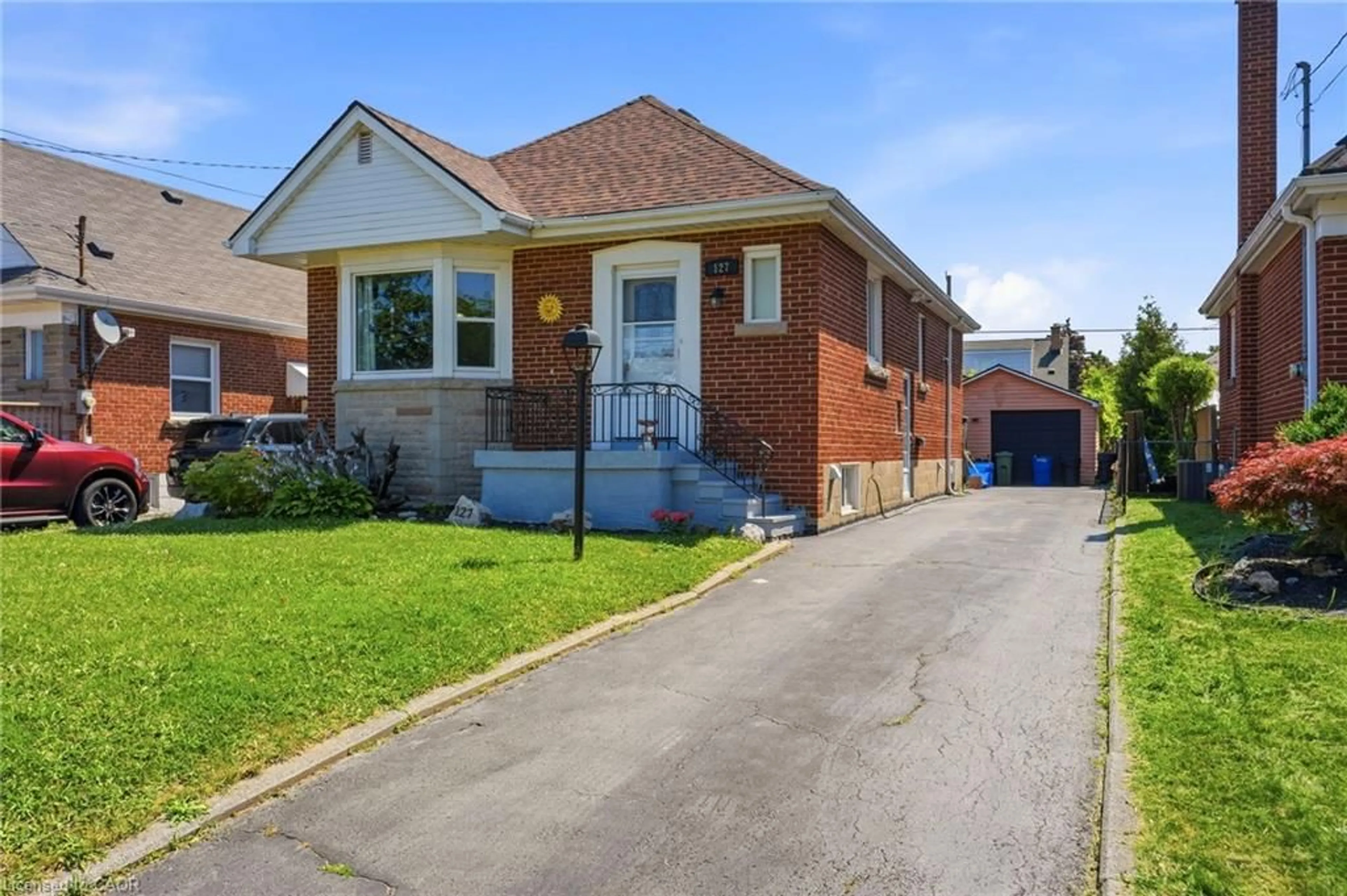 Home with brick exterior material, street for 127 Taylor Ave, Hamilton Ontario L8K 3T1