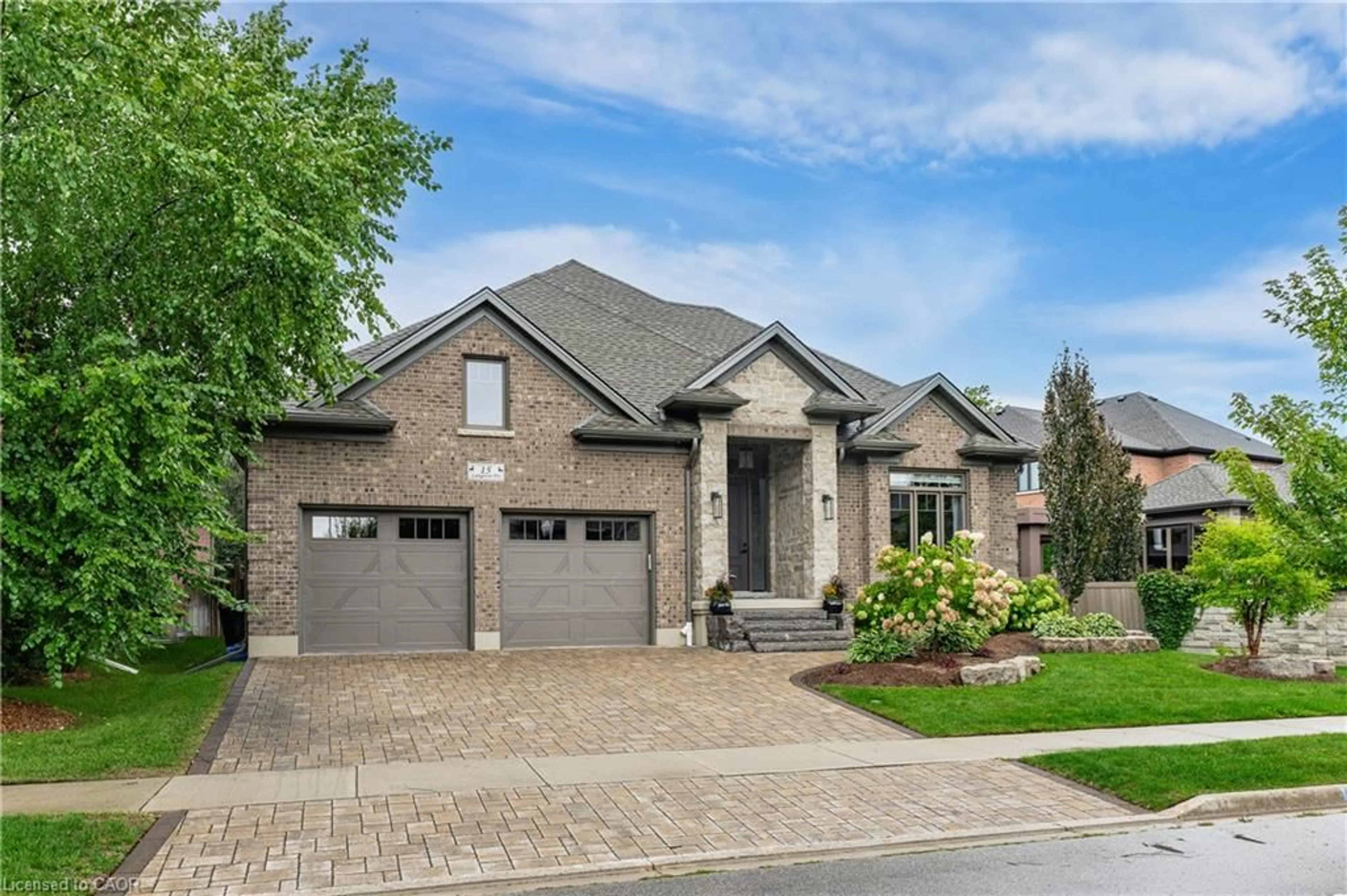 Home with brick exterior material, street for 15 Langton Dr, Kitchener Ontario N2P 2X9