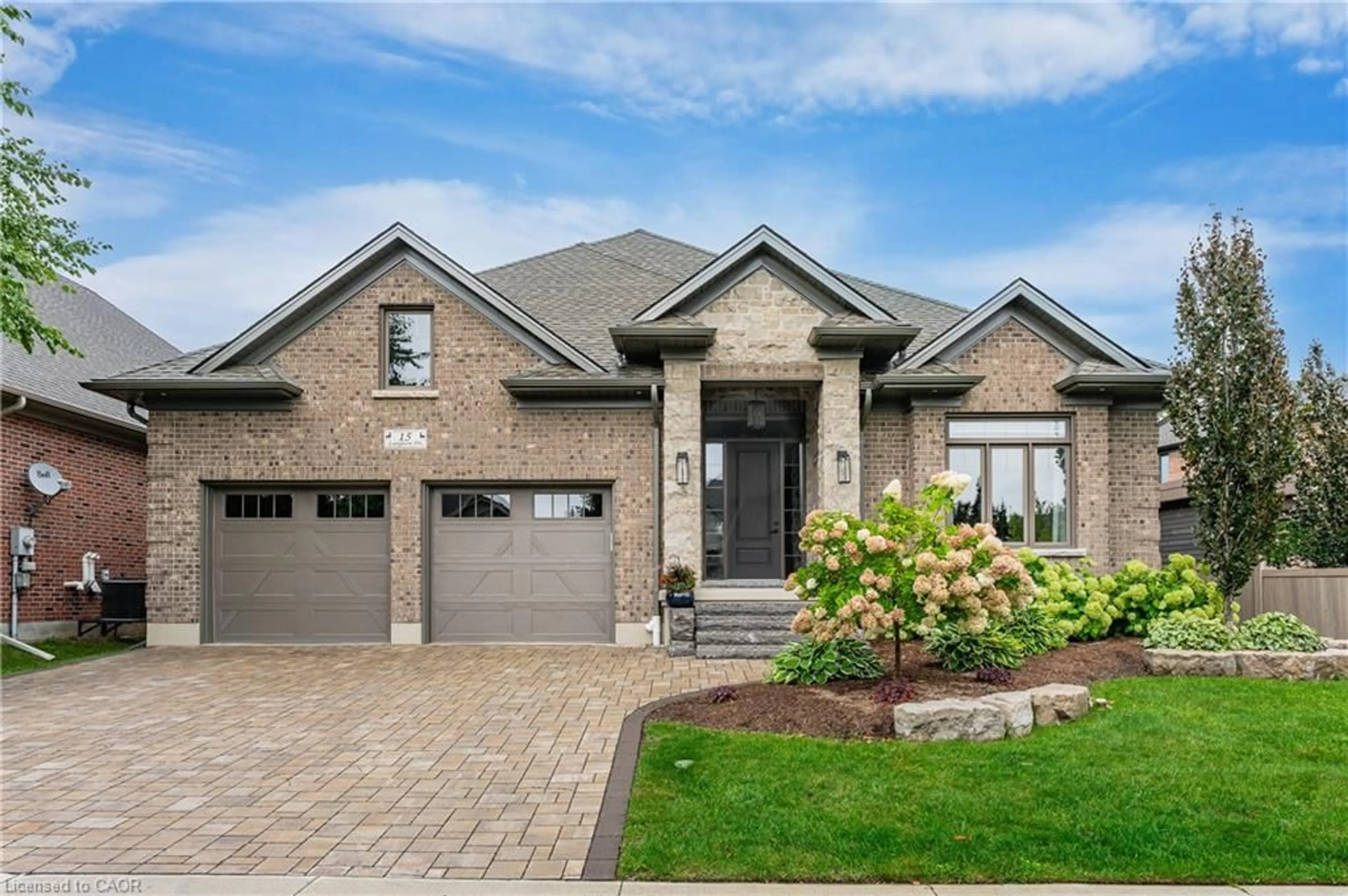 Home with brick exterior material, street for 15 Langton Dr, Kitchener Ontario N2P 2X9
