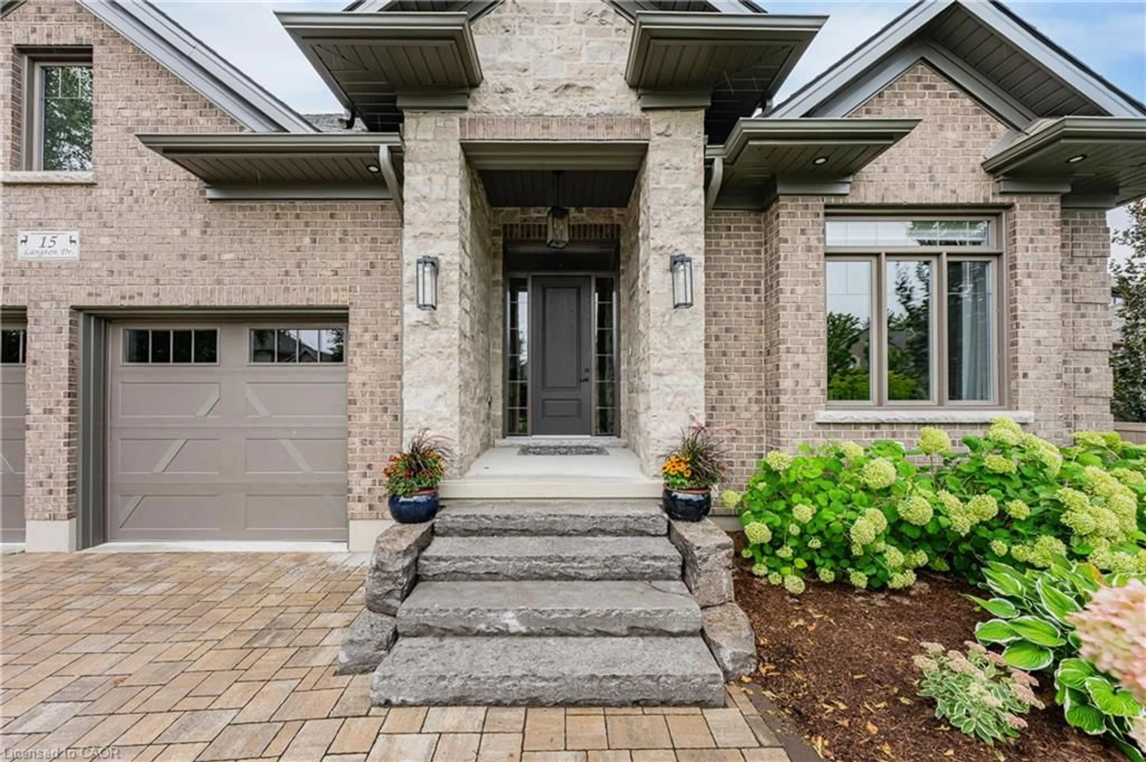 Home with brick exterior material, street for 15 Langton Dr, Kitchener Ontario N2P 2X9