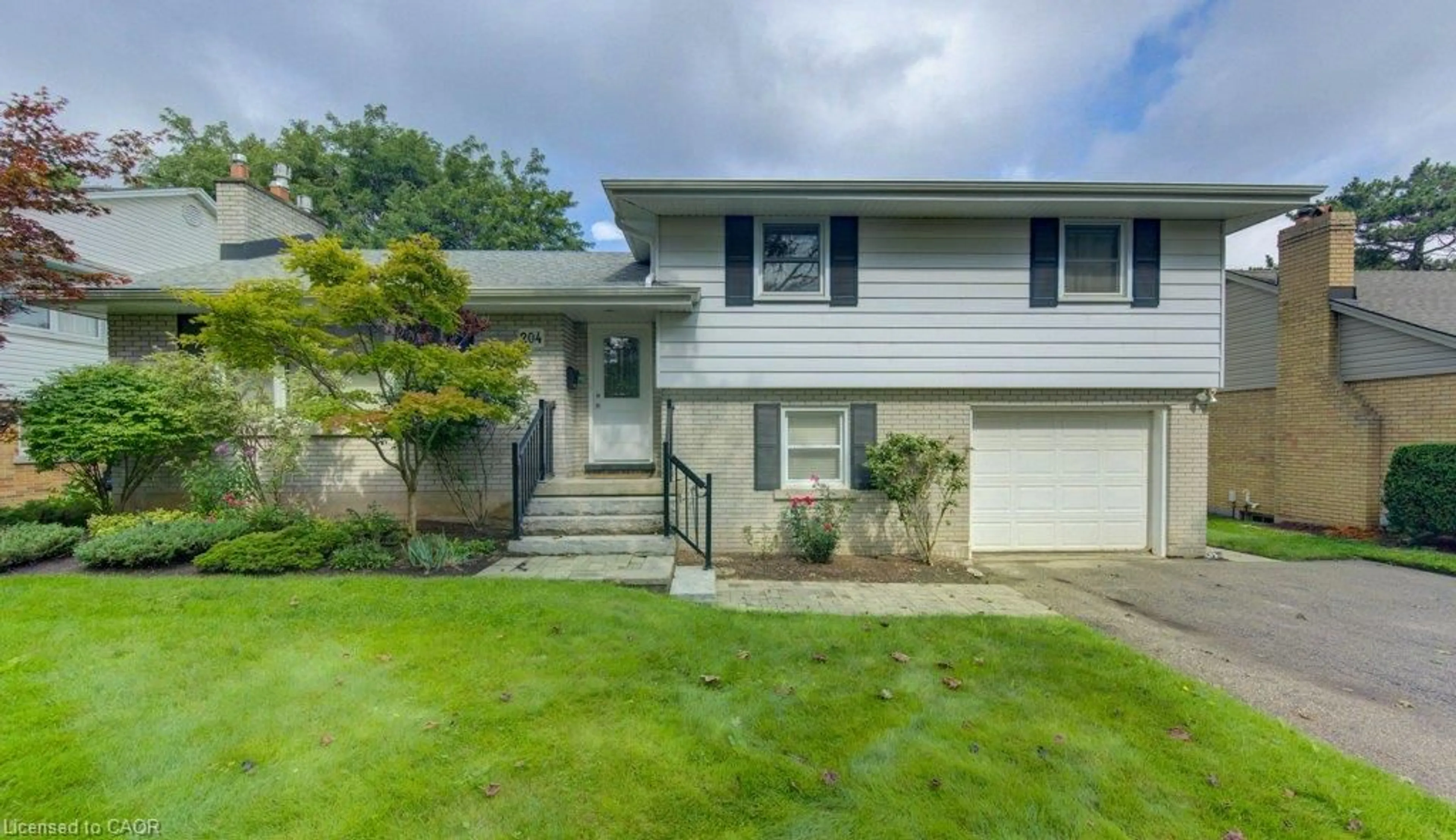 Home with vinyl exterior material, street for 204 Stanley Dr, Waterloo Ontario N2L 1H4