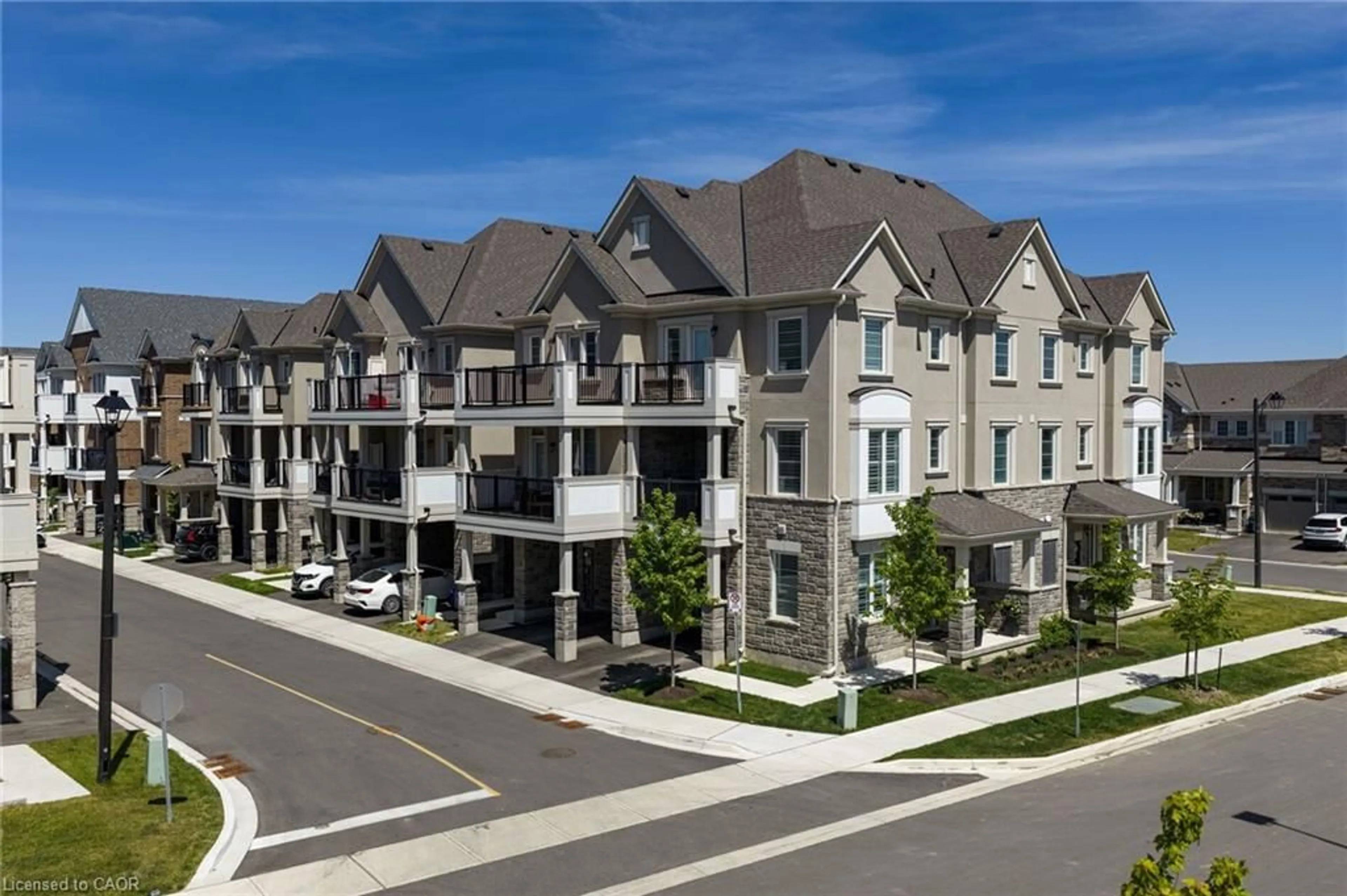 A pic from outside/outdoor area/front of a property/back of a property/a pic from drone, street for 1317 Leriche Way #86, Milton Ontario L9E 0H5