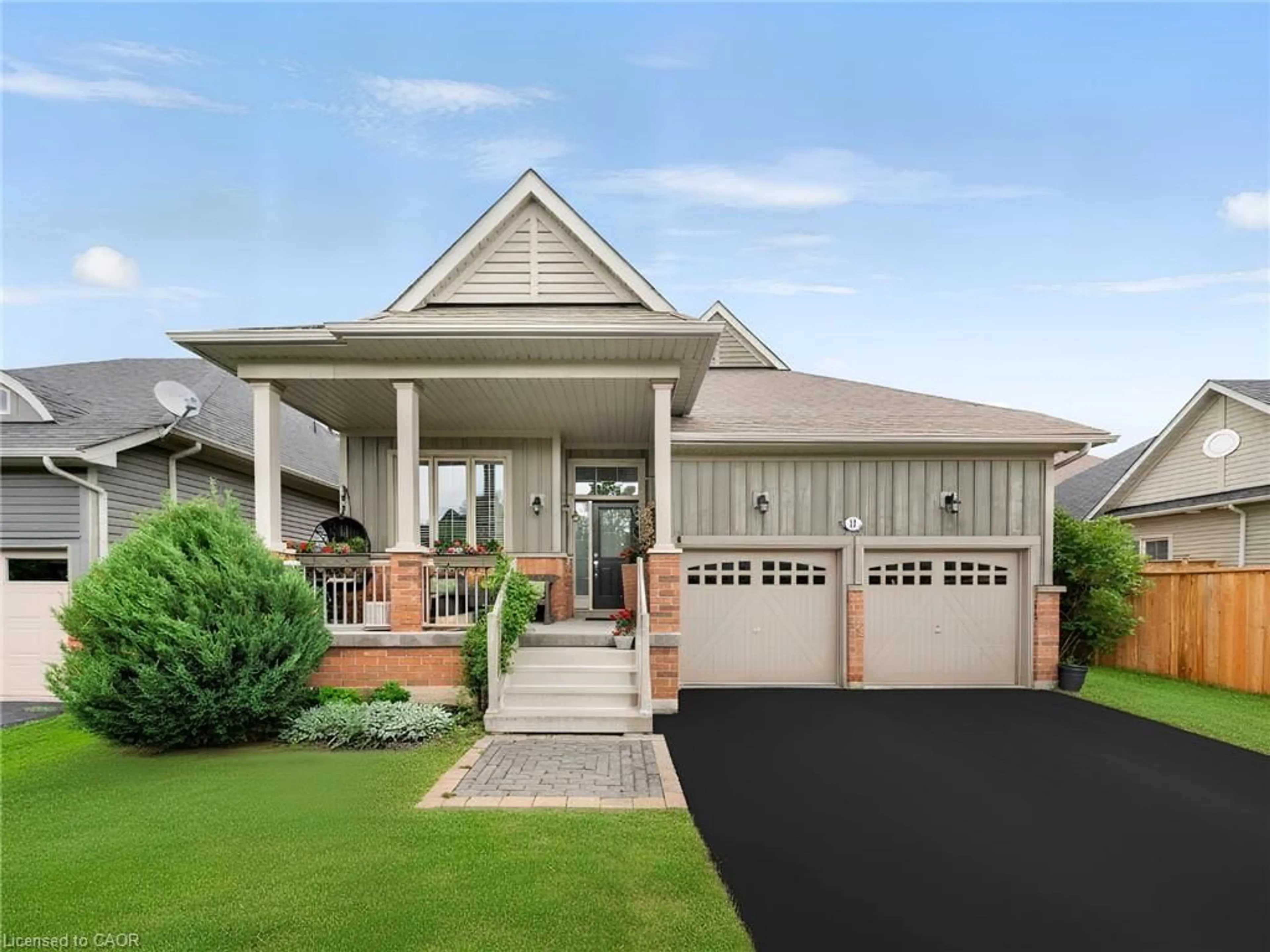 Home with vinyl exterior material, street for 18 Hughes St, Collingwood Ontario L9Y 0W7
