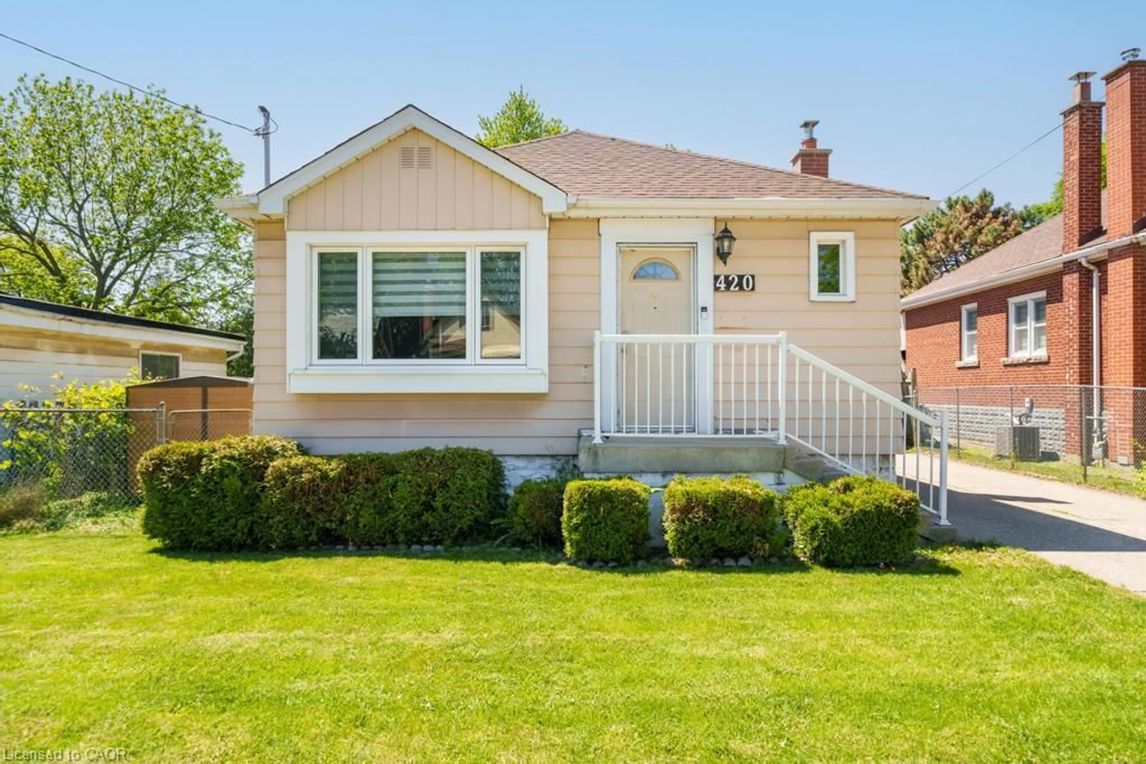 Home with vinyl exterior material, street for 420 Upper Gage Ave, Hamilton Ontario L8V 4H9