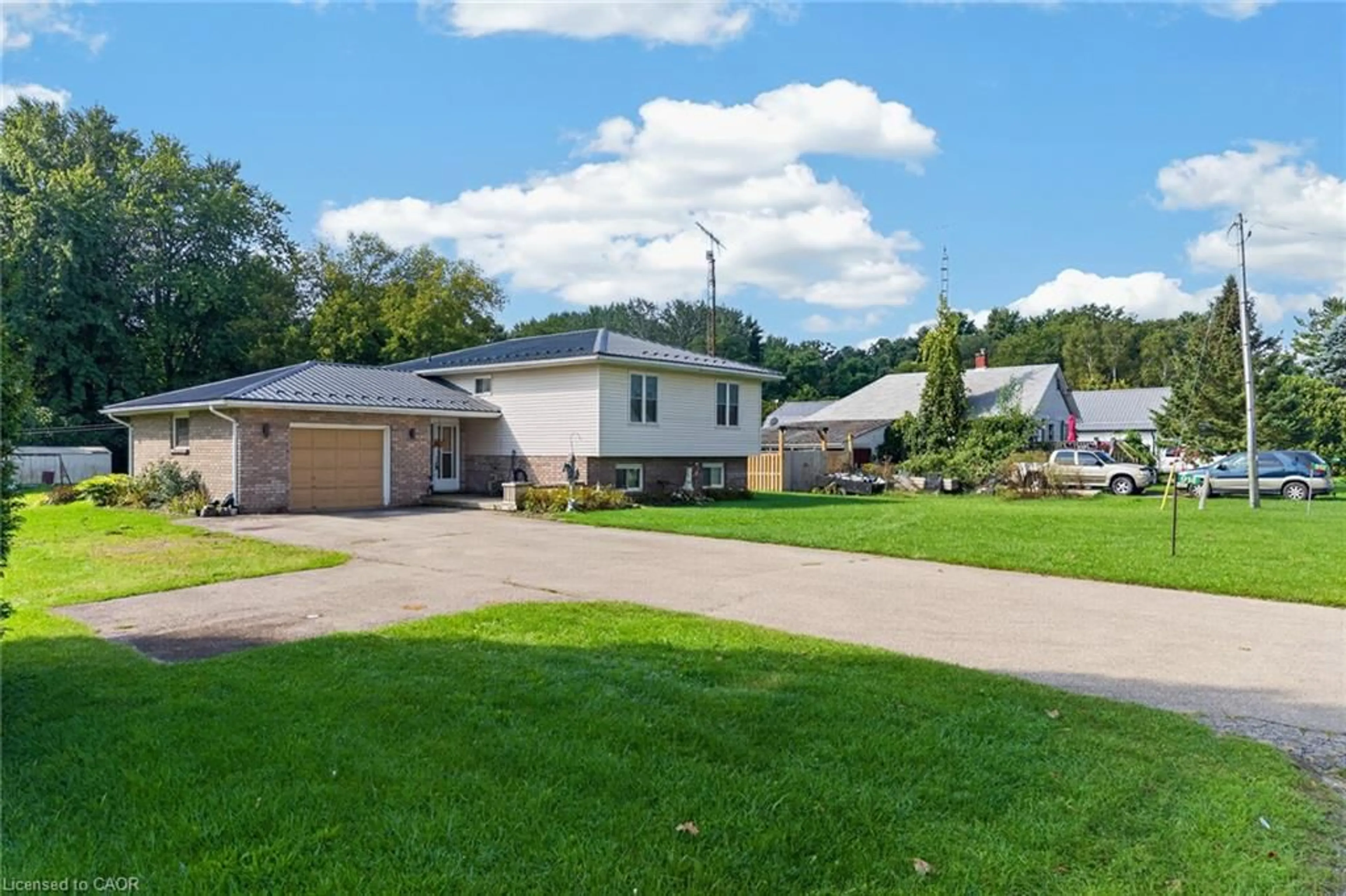 A pic from outside/outdoor area/front of a property/back of a property/a pic from drone, street for 914 Windham Road 11 Rd, Delhi Ontario N4B 2W5