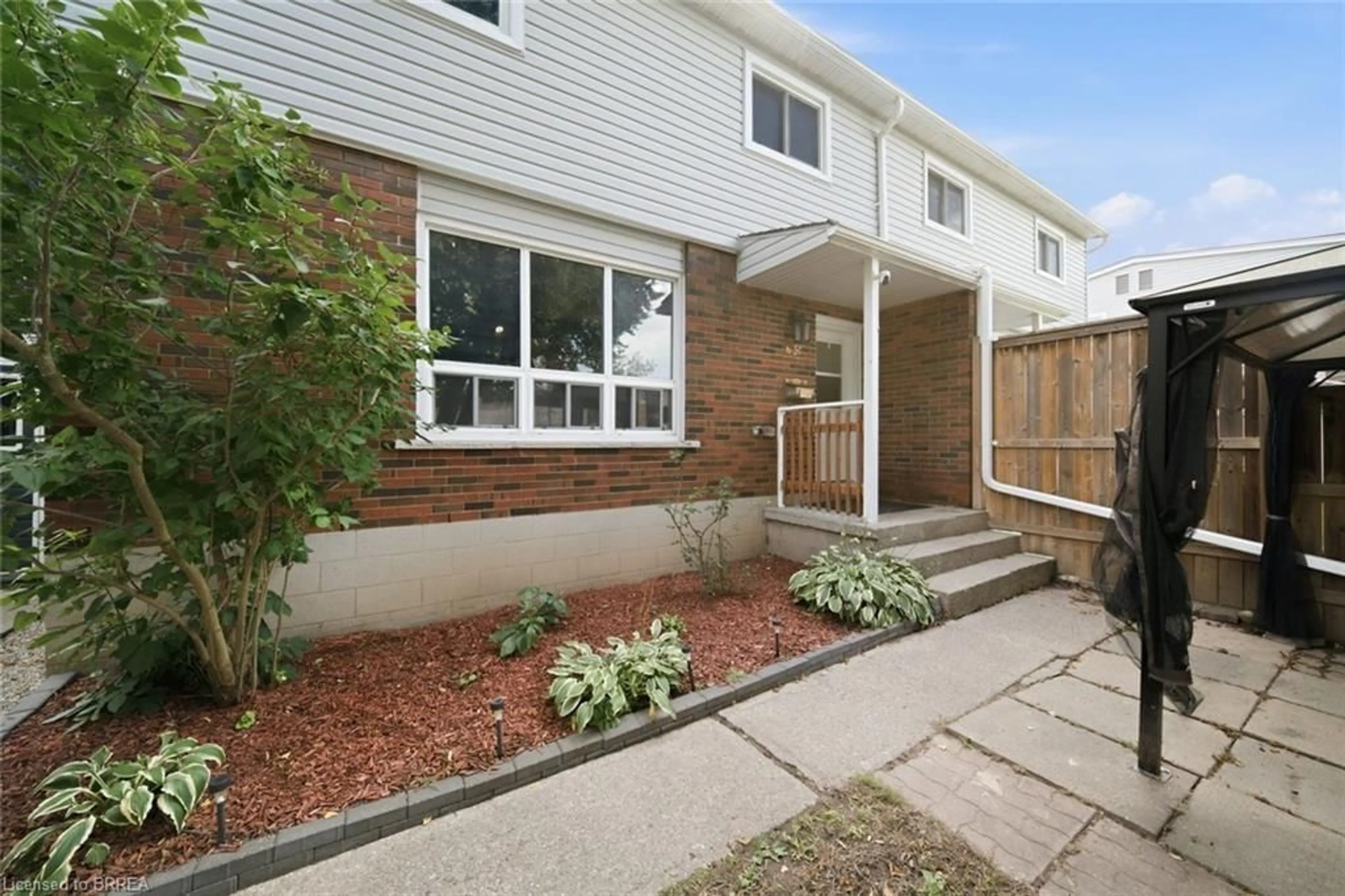 Home with brick exterior material, street for 63 Metcalfe Cres #C, Brantford Ontario N3R 2L7