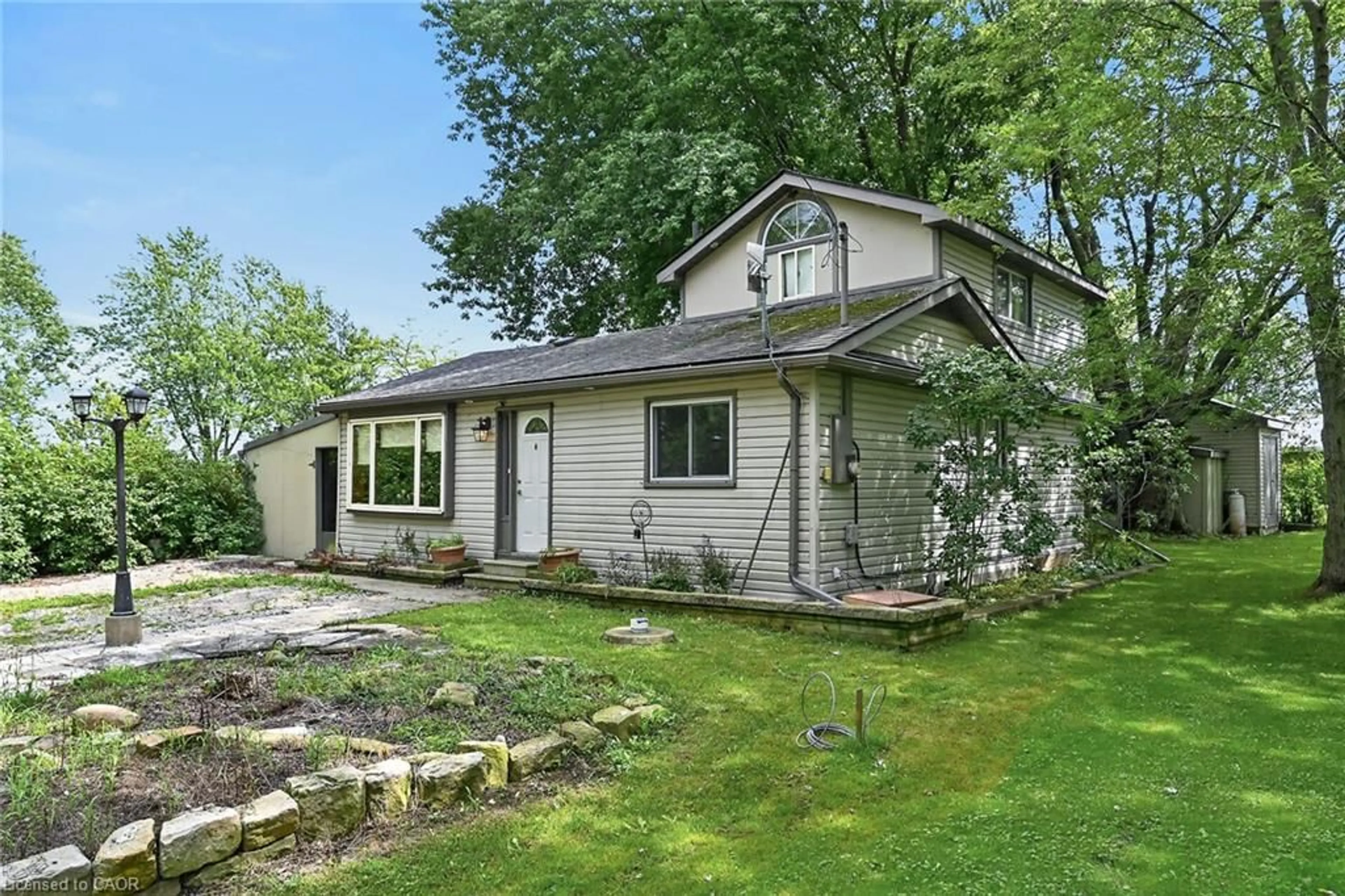 Home with vinyl exterior material, street for 64 Windy Line, Lowbanks Ontario N0A 1K0