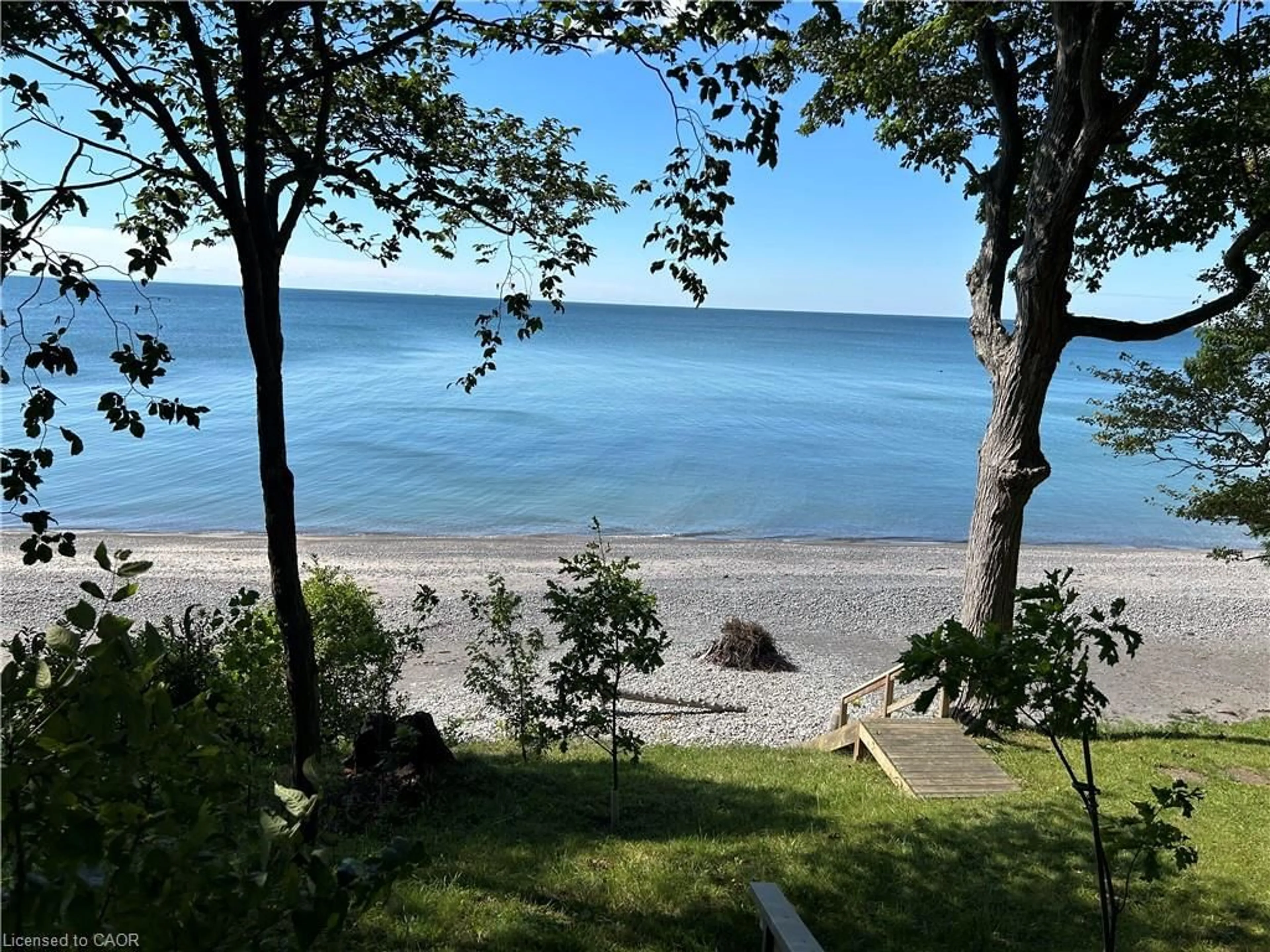 A pic from outside/outdoor area/front of a property/back of a property/a pic from drone, water/lake/river/ocean view for 23 Upper Mohawk Pt, Lowbanks Ontario N0A 1K0
