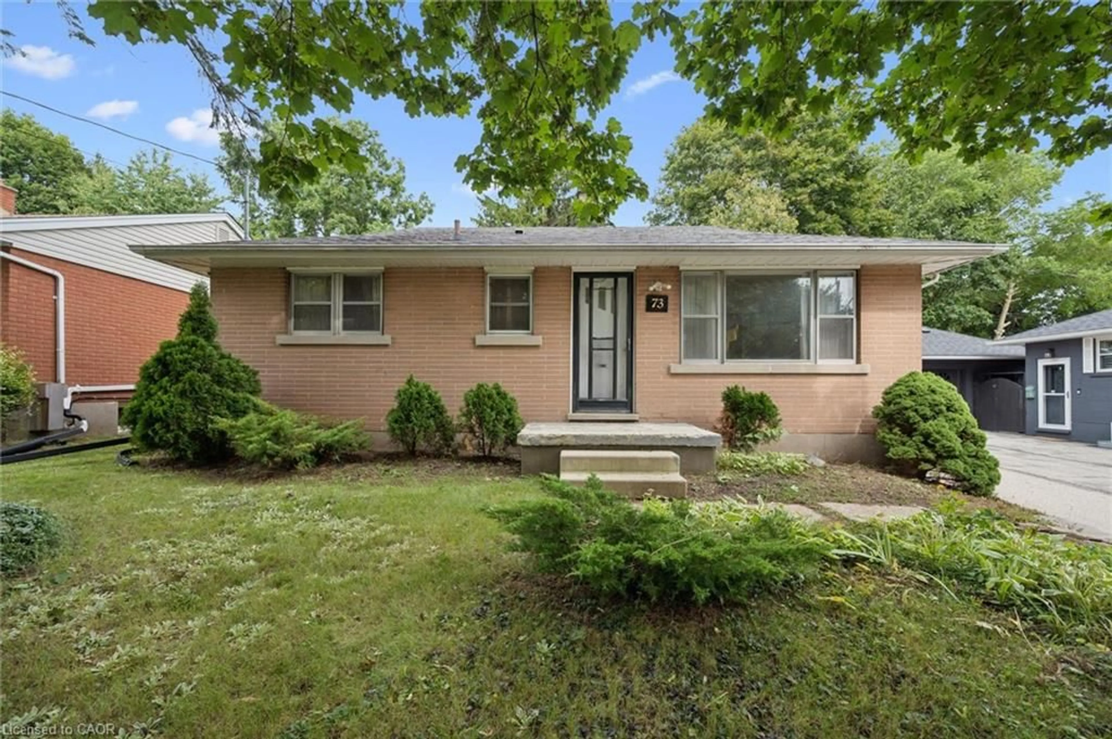 Home with brick exterior material, street for 73 Knightswood Blvd, Guelph Ontario N1E 3W6