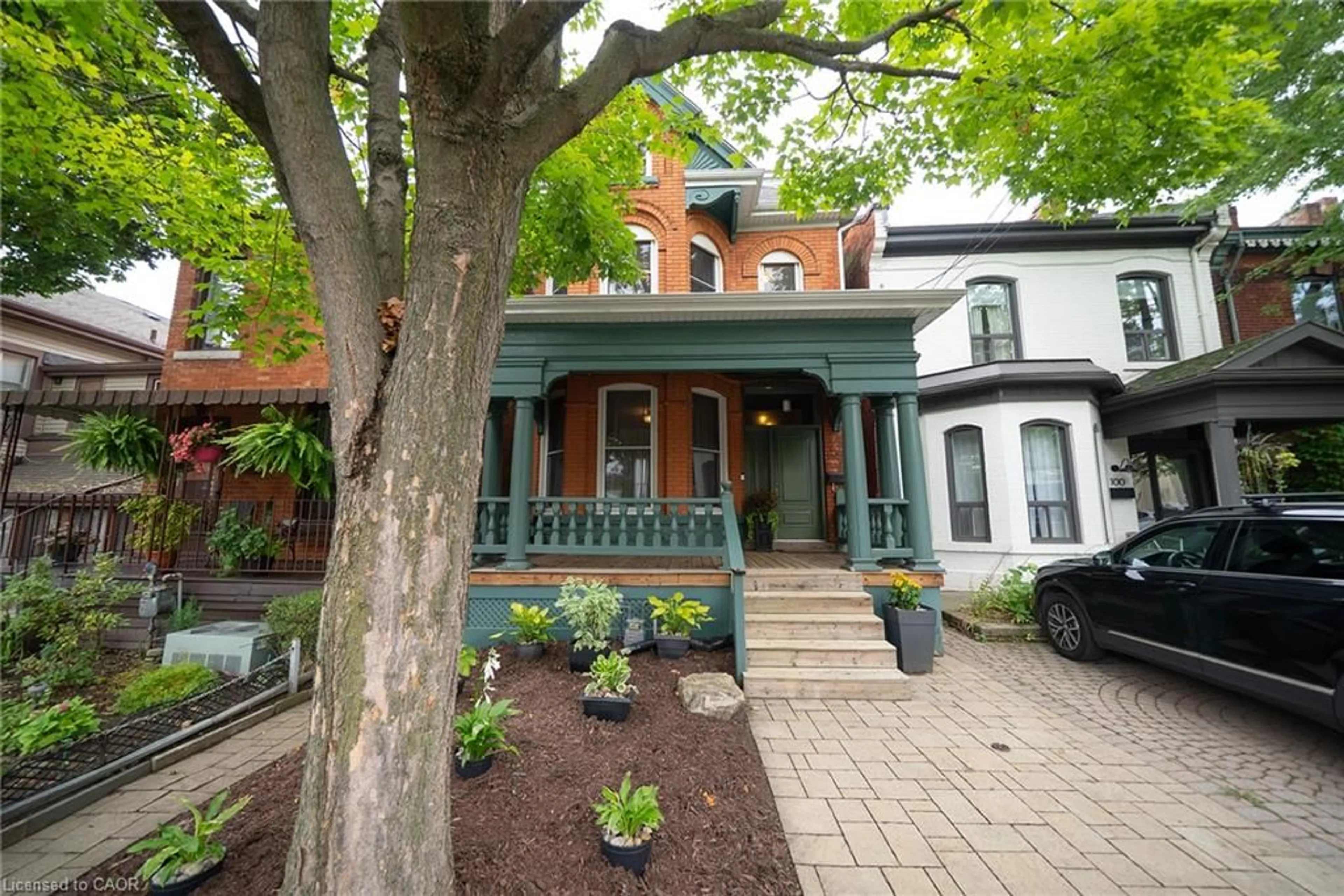 Home with brick exterior material, street for 102 Pearl St, Hamilton Ontario L8R 2Z3