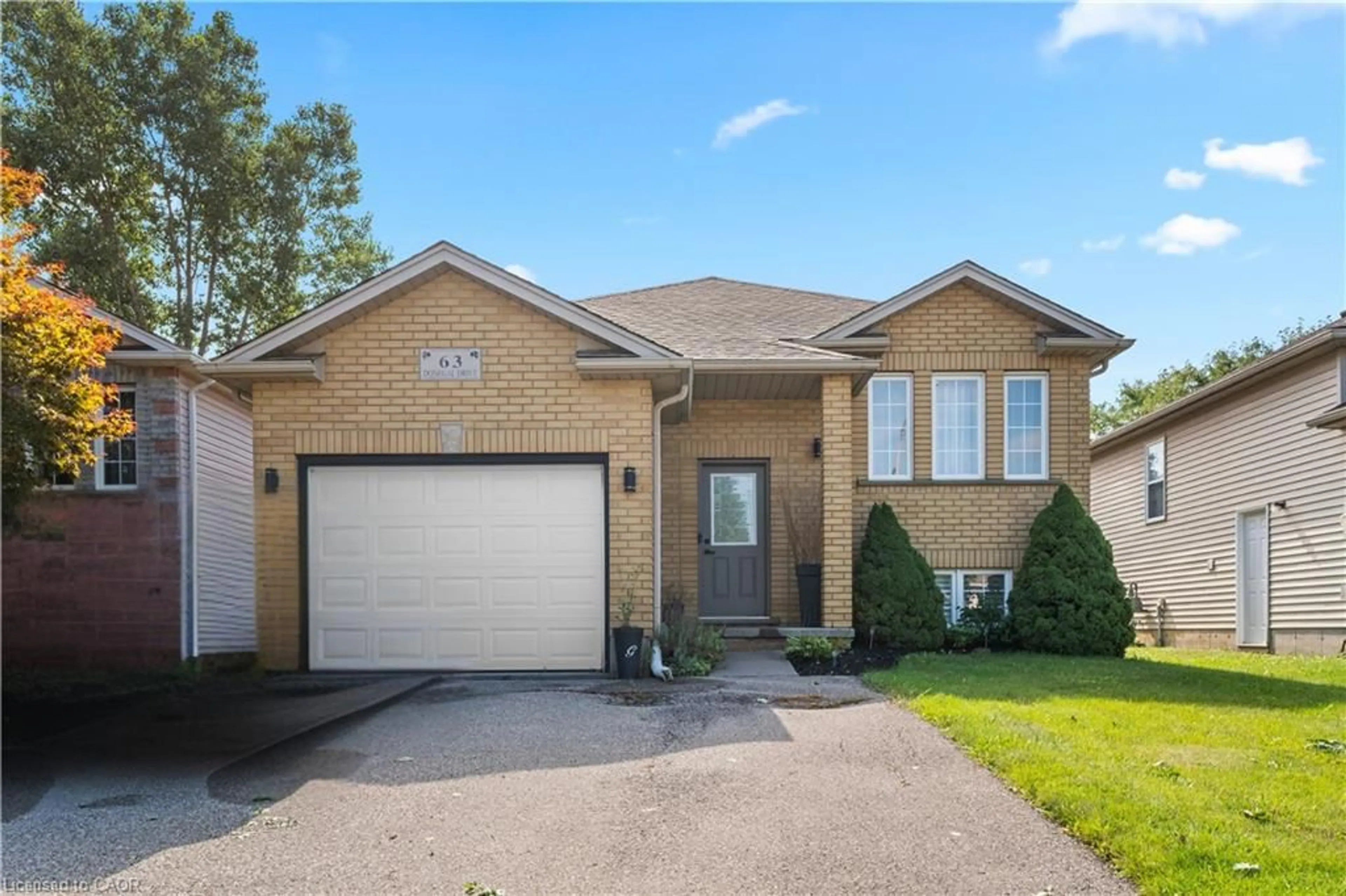 Home with brick exterior material, street for 63 Donegal Dr, Brantford Ontario N3T 6L2