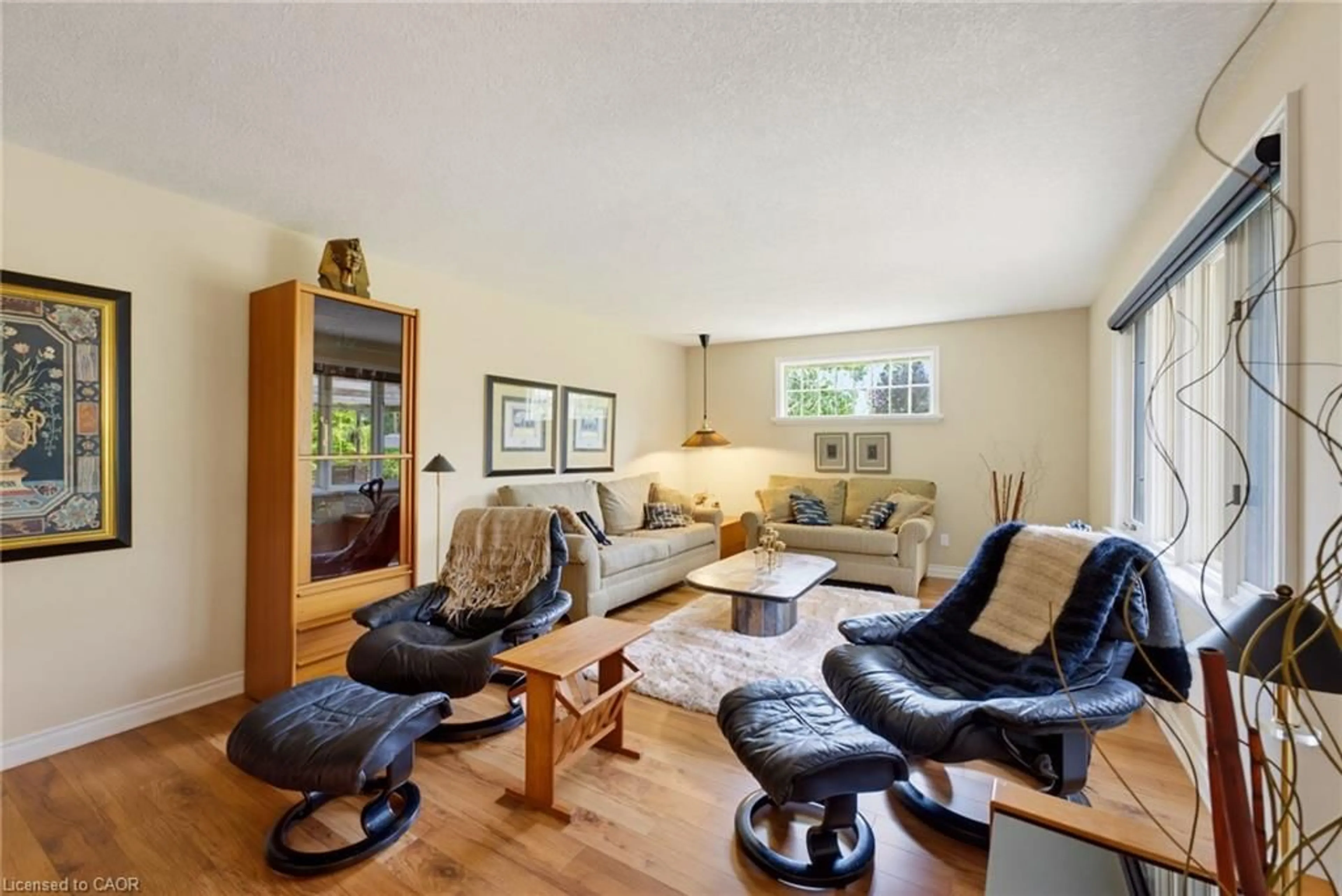 Living room with furniture, wood/laminate floor for 298 Woodview Dr, Atwood Ontario N0G 1B0