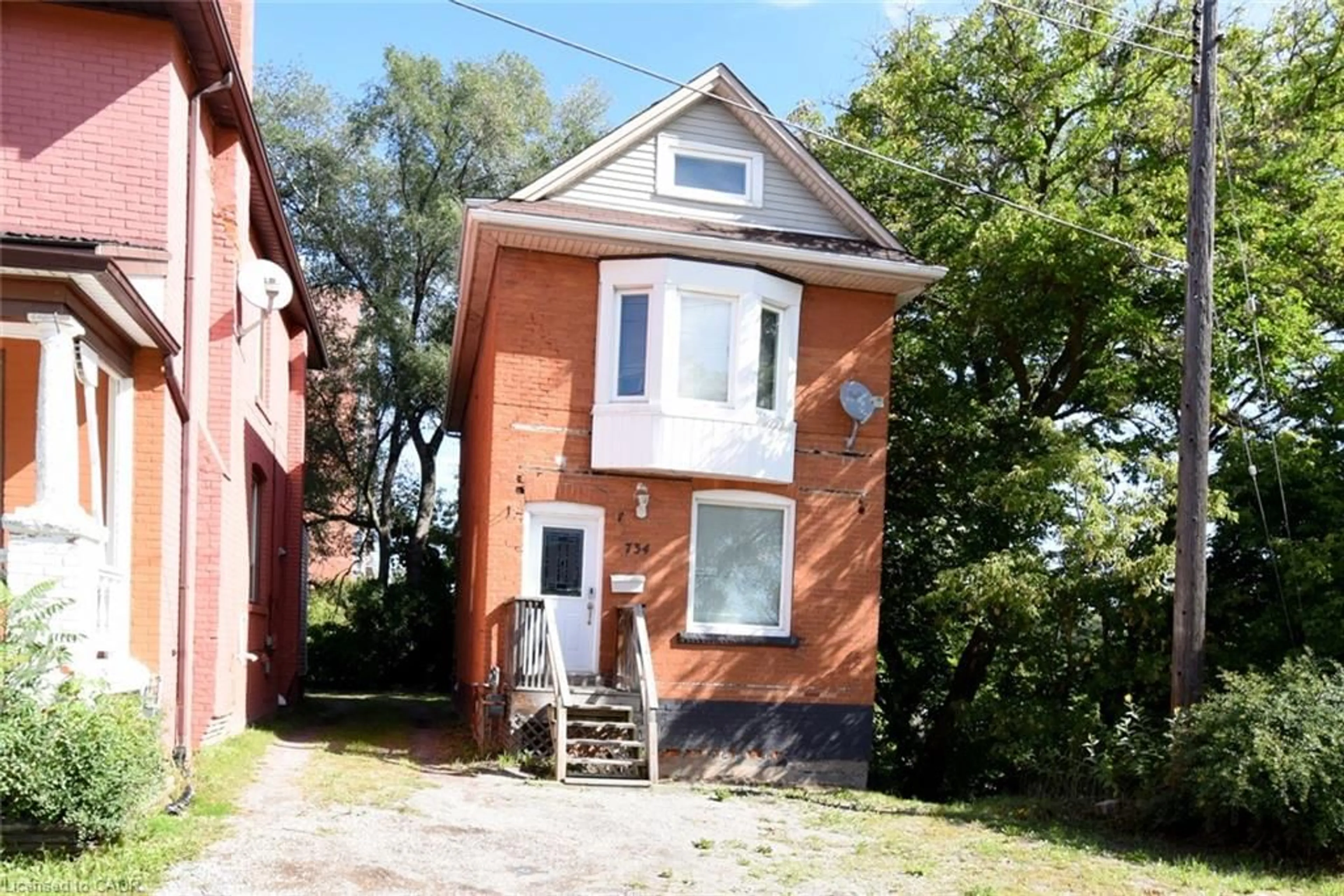 Home with brick exterior material, street for 734 King St, Hamilton Ontario L8S 1J8