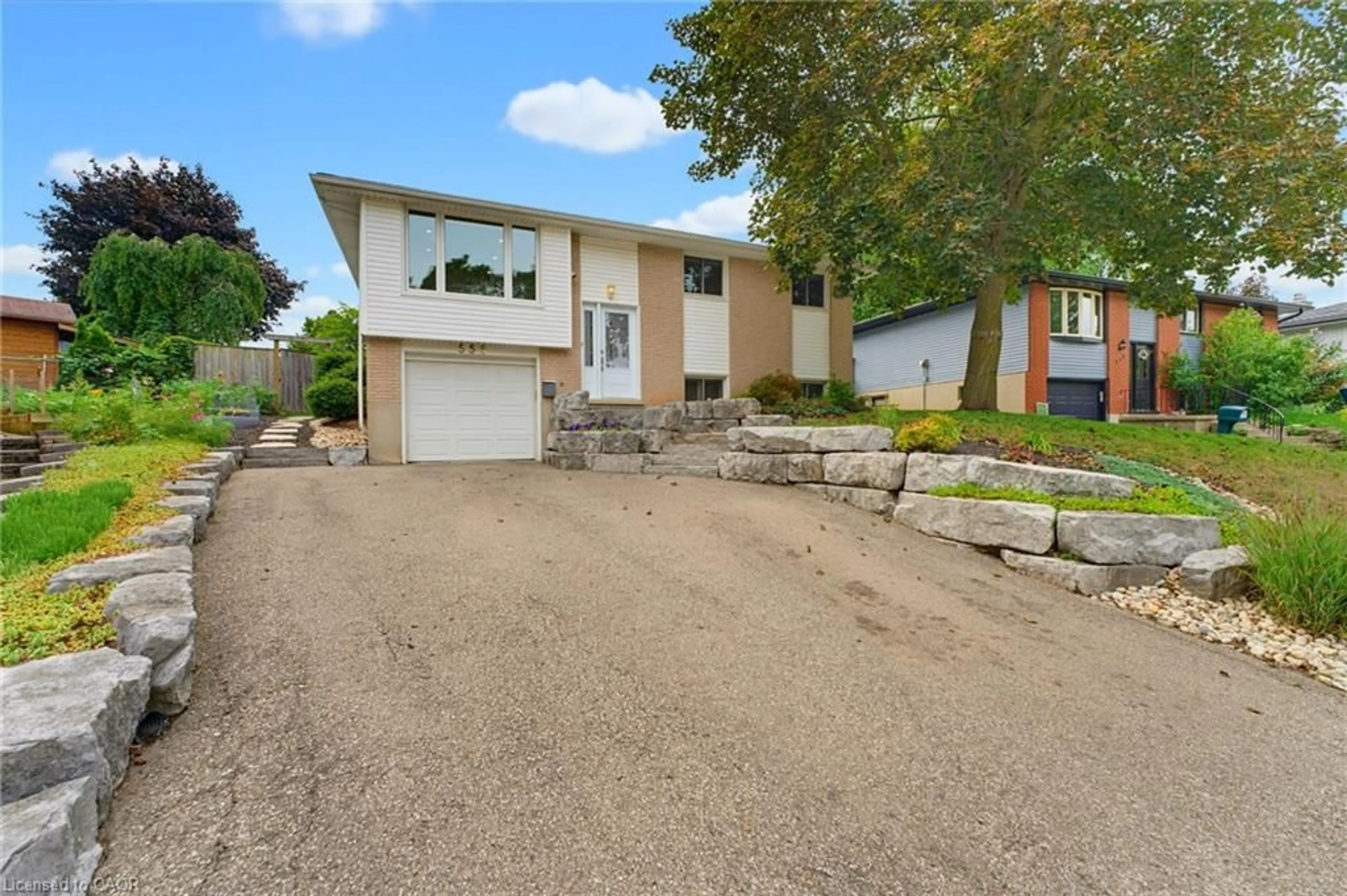 Home with brick exterior material, street for 555 Elm Ridge Pl, Waterloo Ontario N2L 4P6