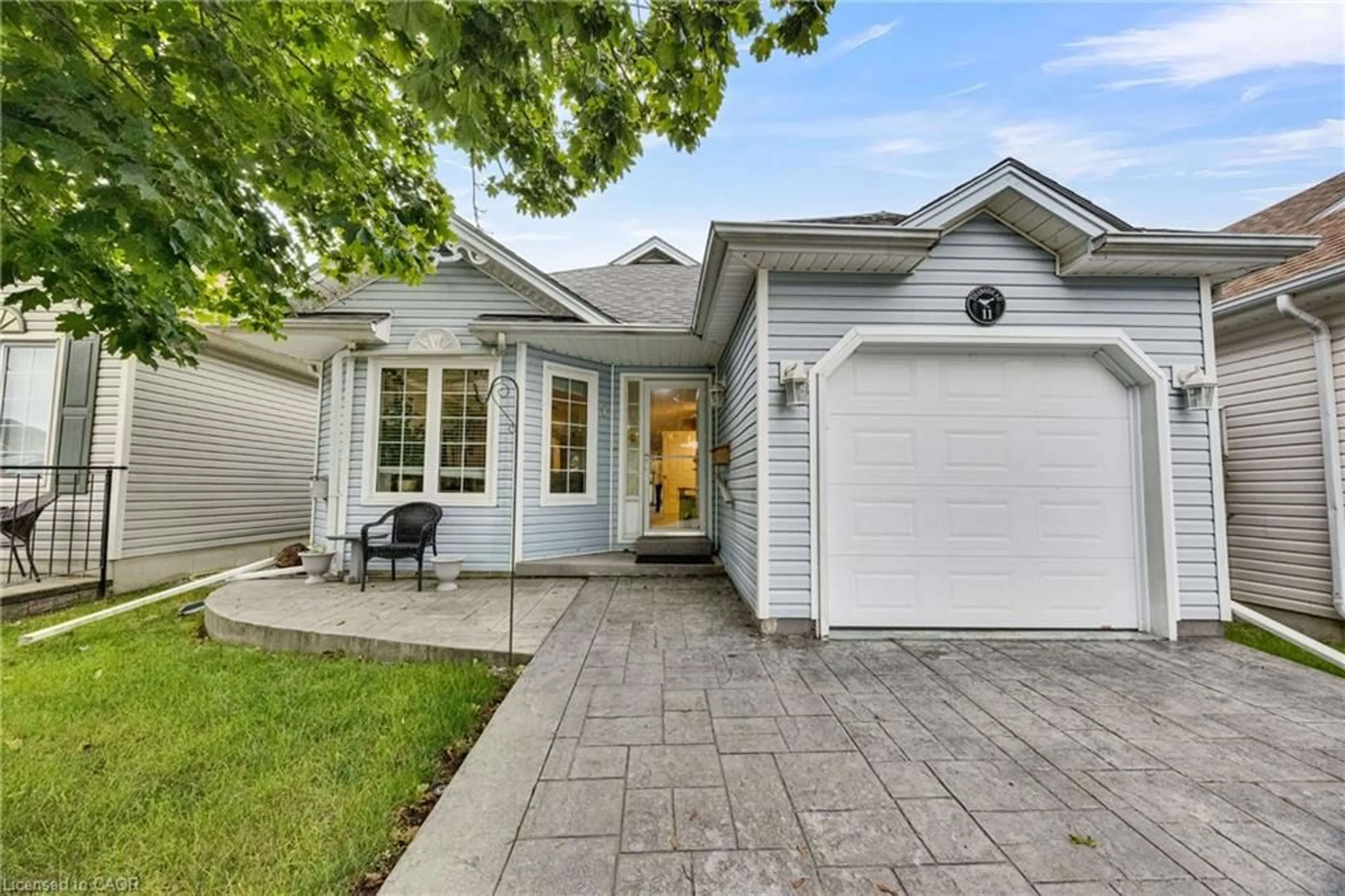 Home with vinyl exterior material, street for 11 Mallard Walk, Port Rowan Ontario N0E 1M0