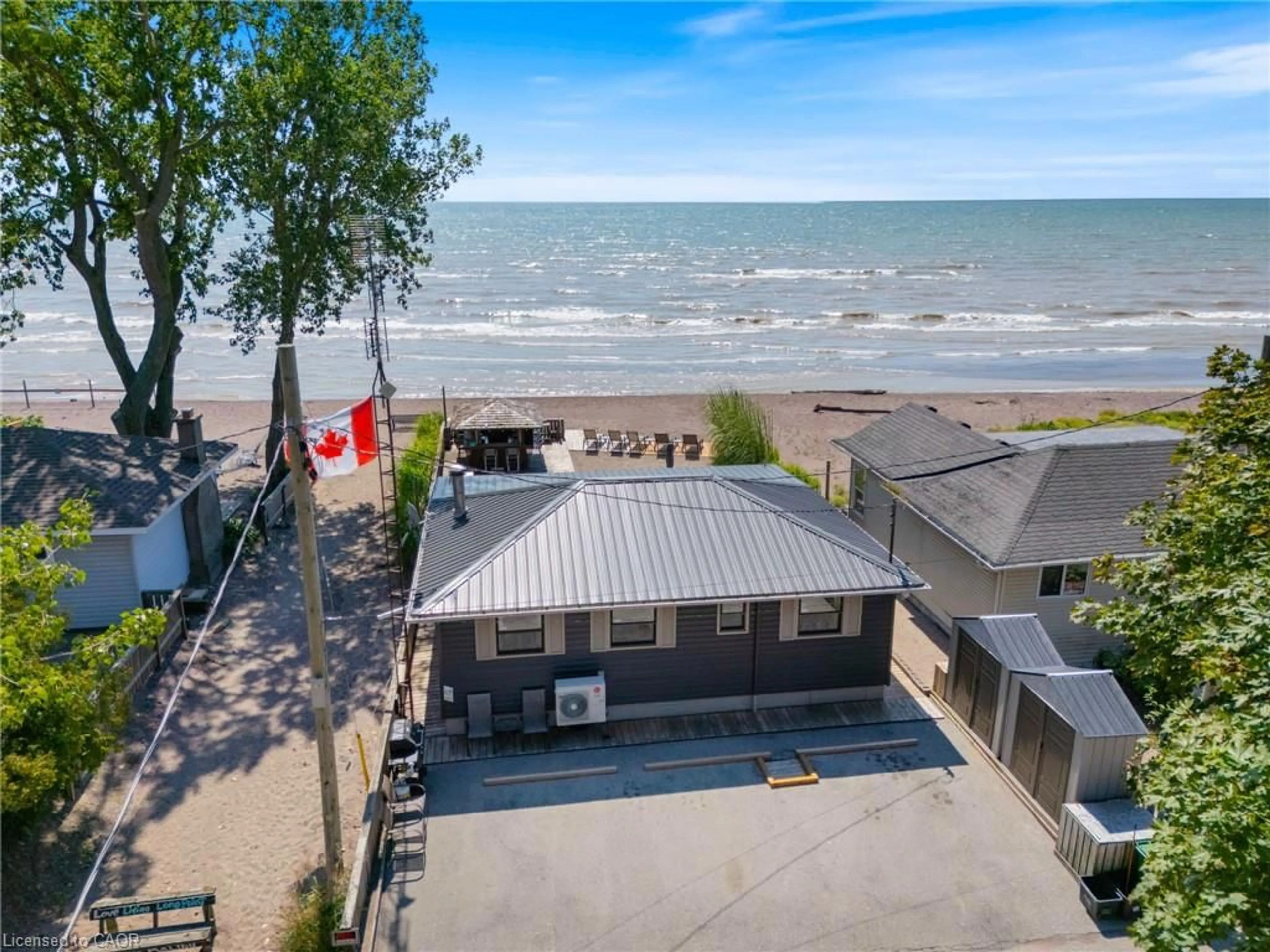 A pic from outside/outdoor area/front of a property/back of a property/a pic from drone, water/lake/river/ocean view for 7 Woodstock Ave, Long Point Ontario N0E 1M0