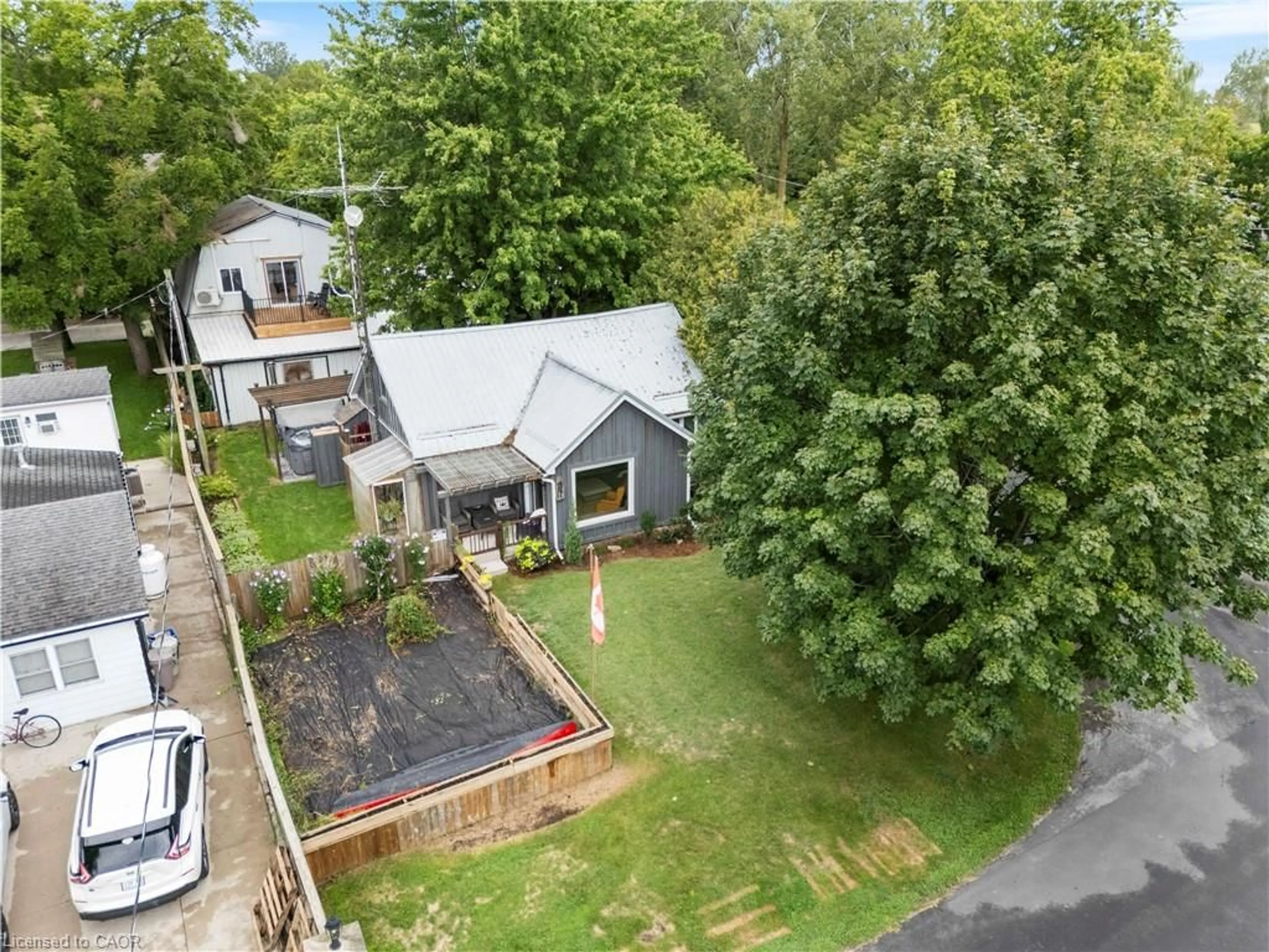 A pic from outside/outdoor area/front of a property/back of a property/a pic from drone, street for 14 Howey Ave, Long Point Ontario N0E 1M0