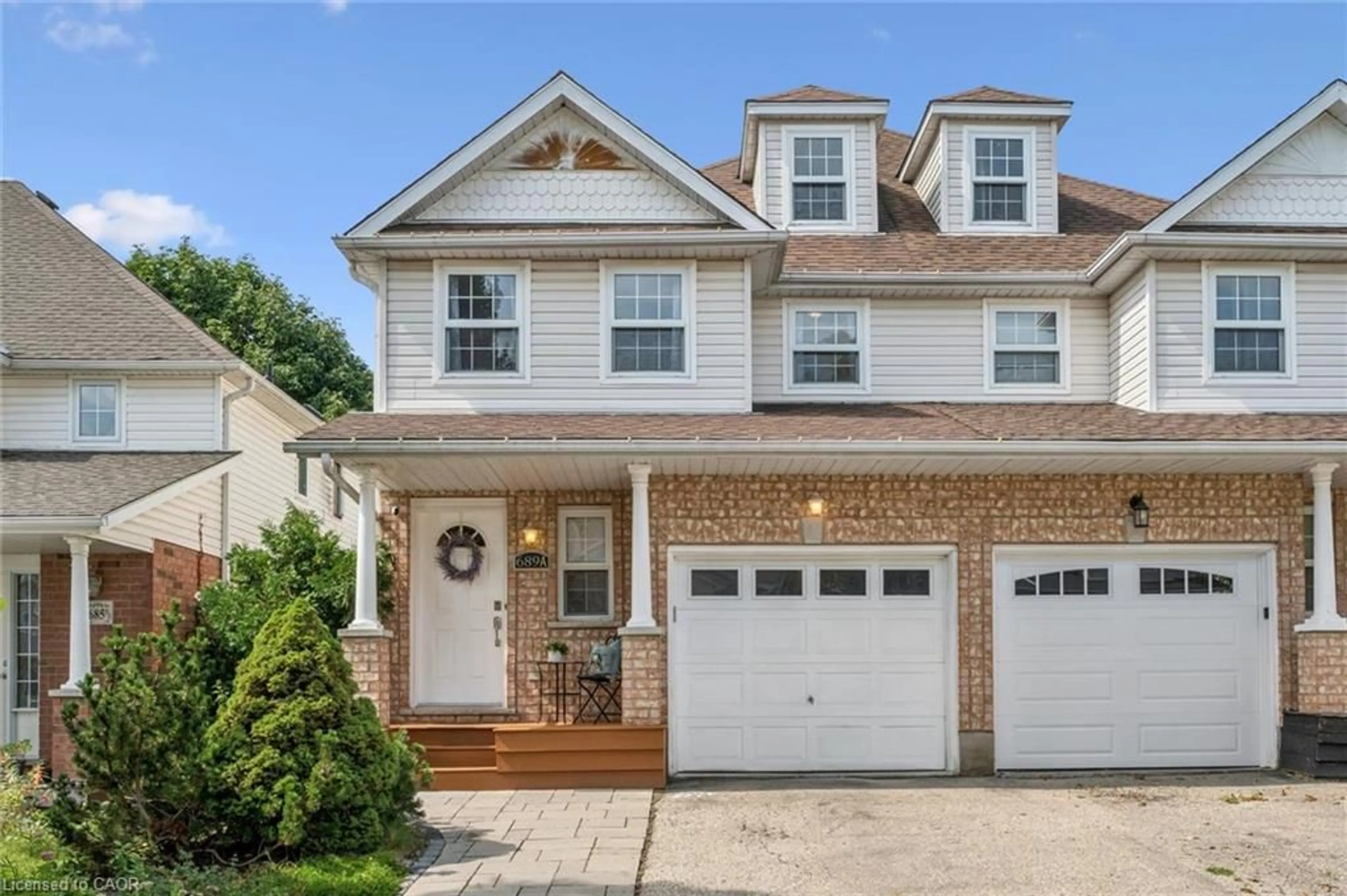 Home with vinyl exterior material, street for 689A Star Flower Ave, Waterloo Ontario N2V 2L2