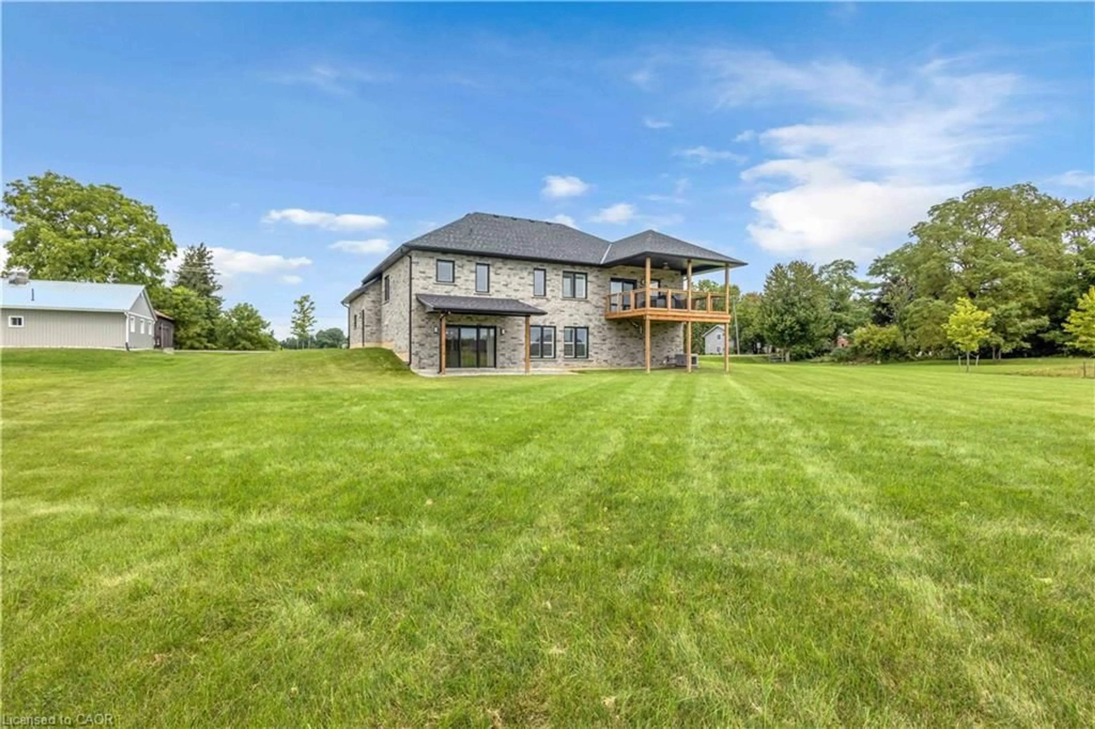 A pic from outside/outdoor area/front of a property/back of a property/a pic from drone, water/lake/river/ocean view for 1410 Thompson Rd, Waterford Ontario N0E 1Y0