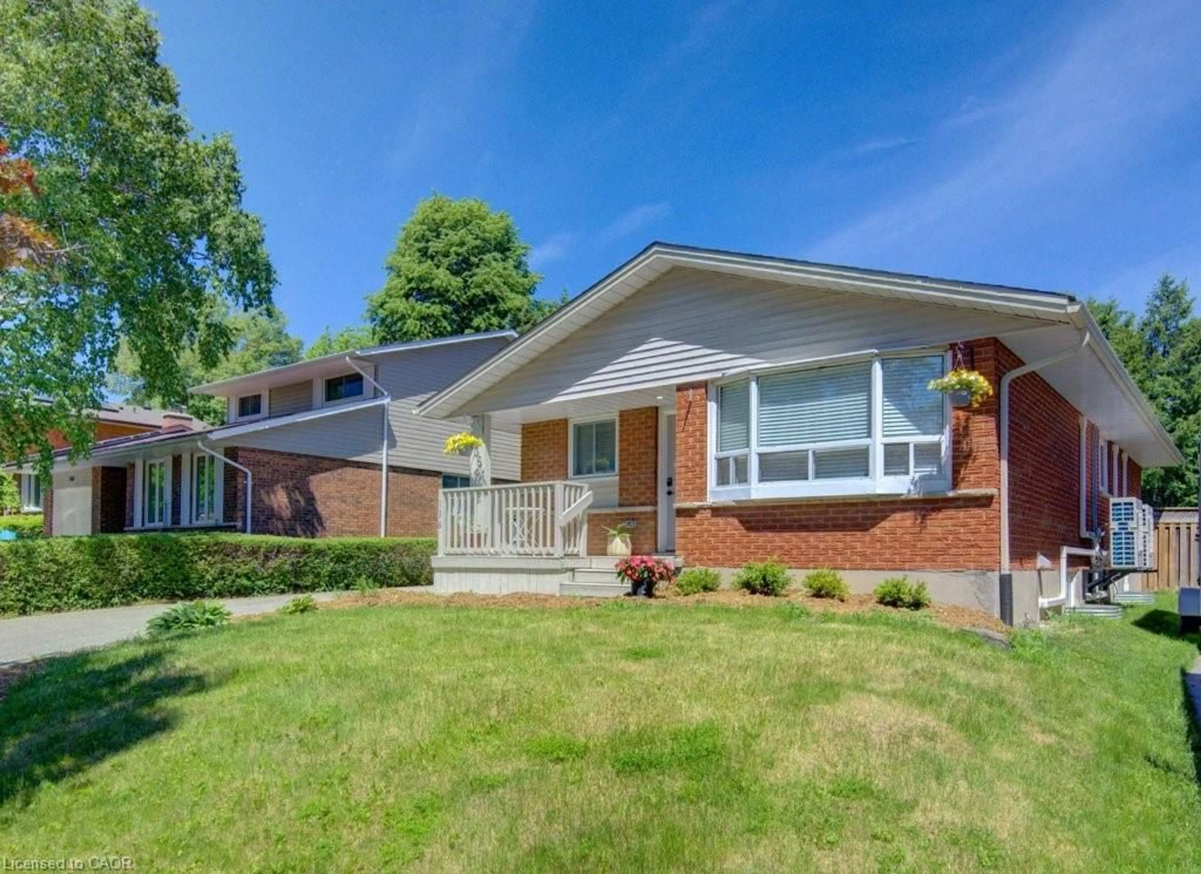 Home with brick exterior material, street for 136 Dunsmere Dr, Kitchener Ontario N2E 1V7