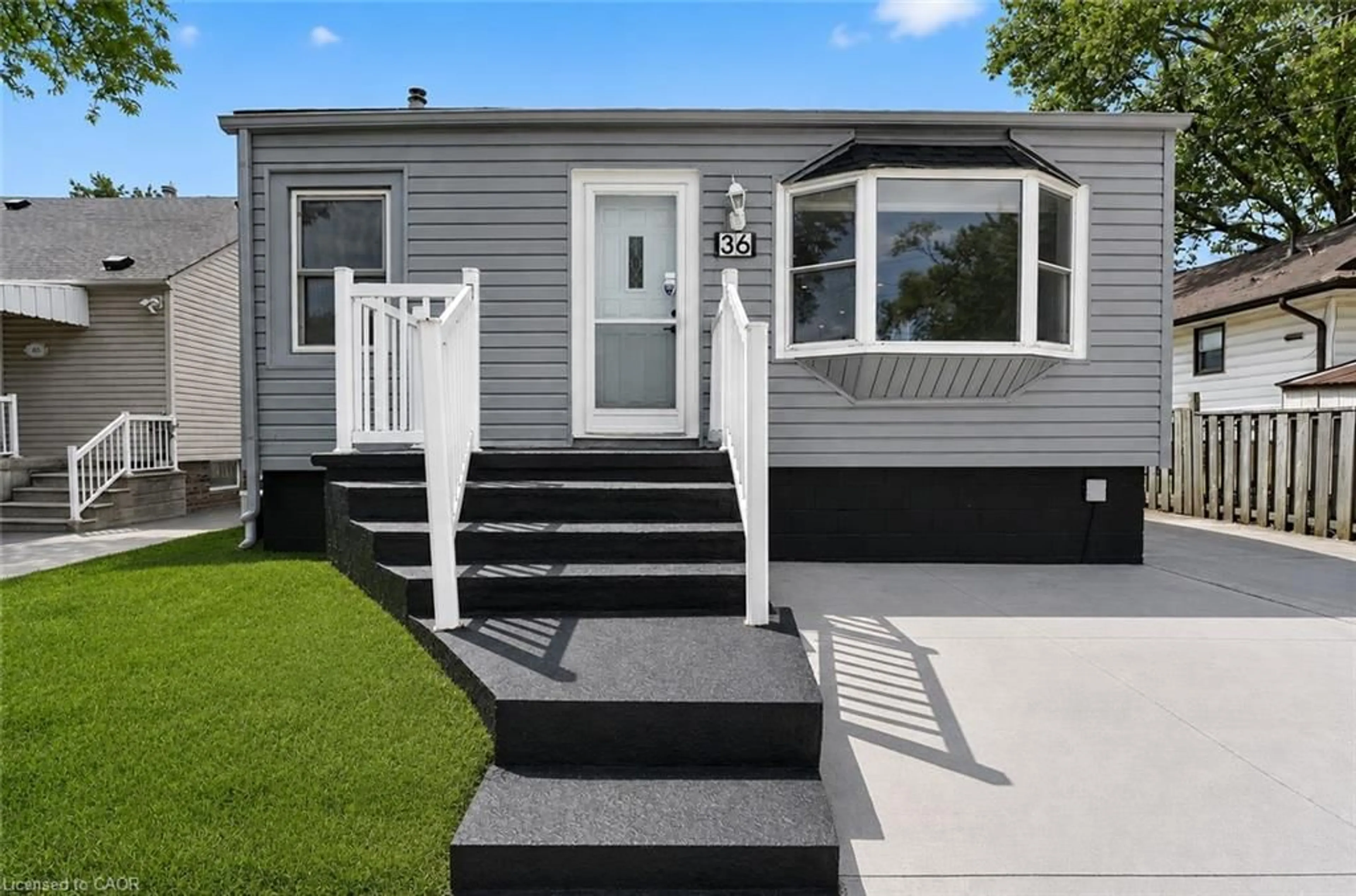 Home with vinyl exterior material, street for 36 Mahony Ave, Hamilton Ontario L8H 3C5