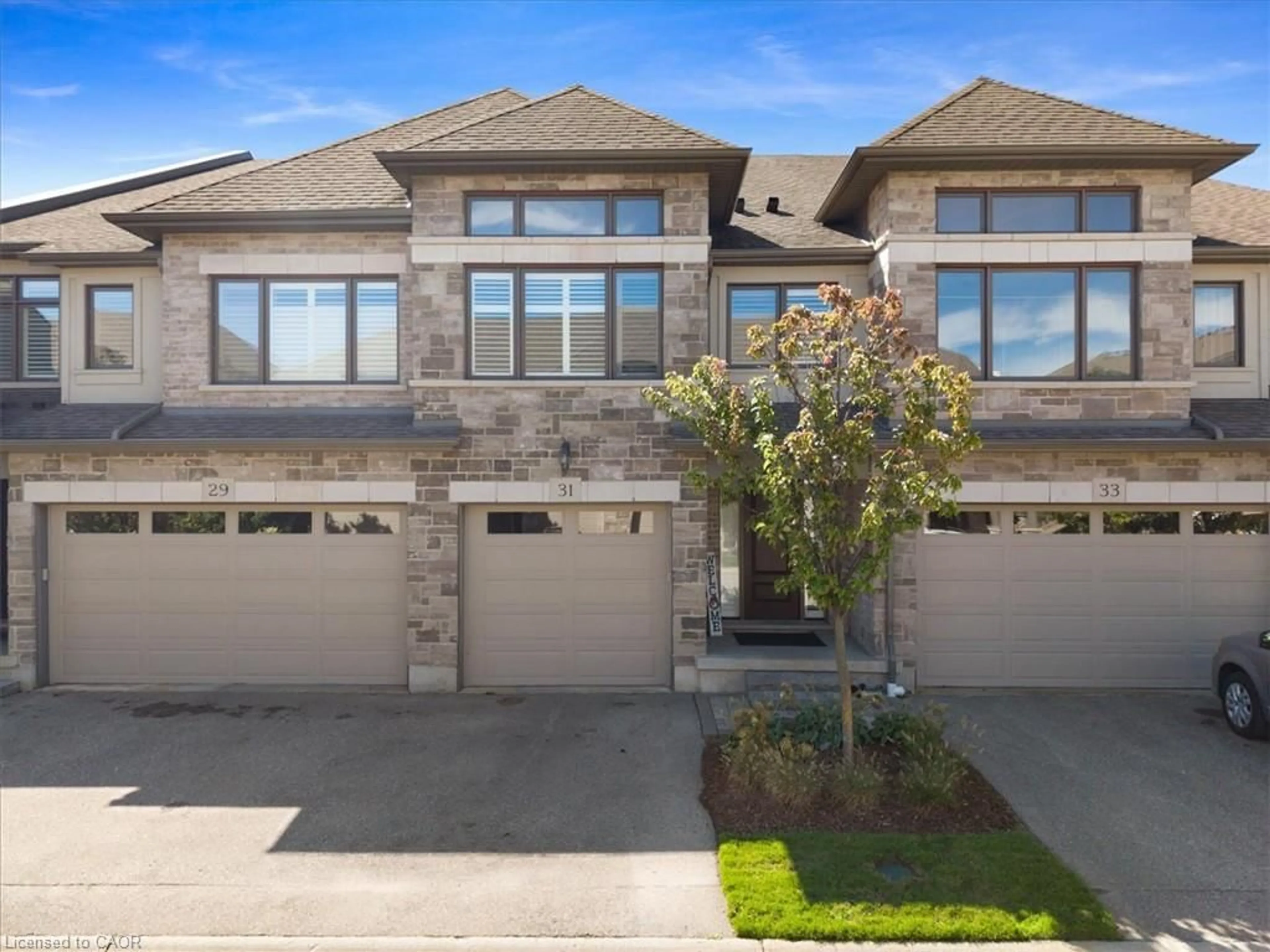 Home with brick exterior material, street for 243 Grey Silo Rd #31, Waterloo Ontario N2K 0B9