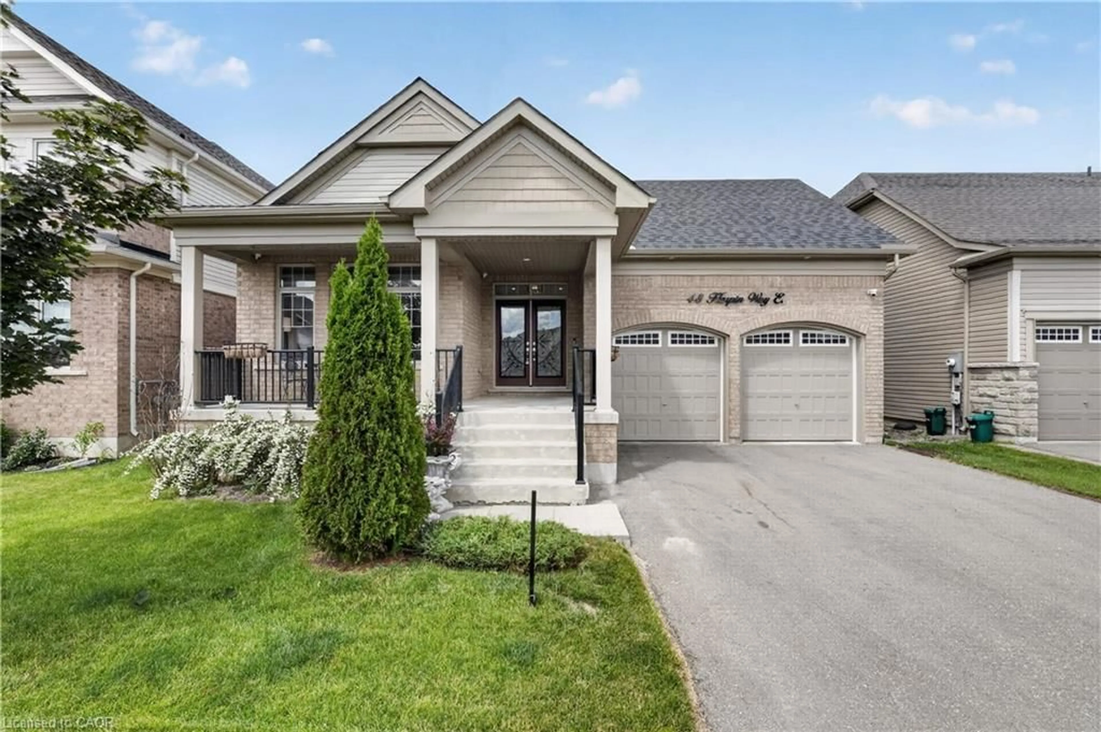 Home with brick exterior material, street for 48 Harpin Way, Centre Wellington Ontario N1M 0E9