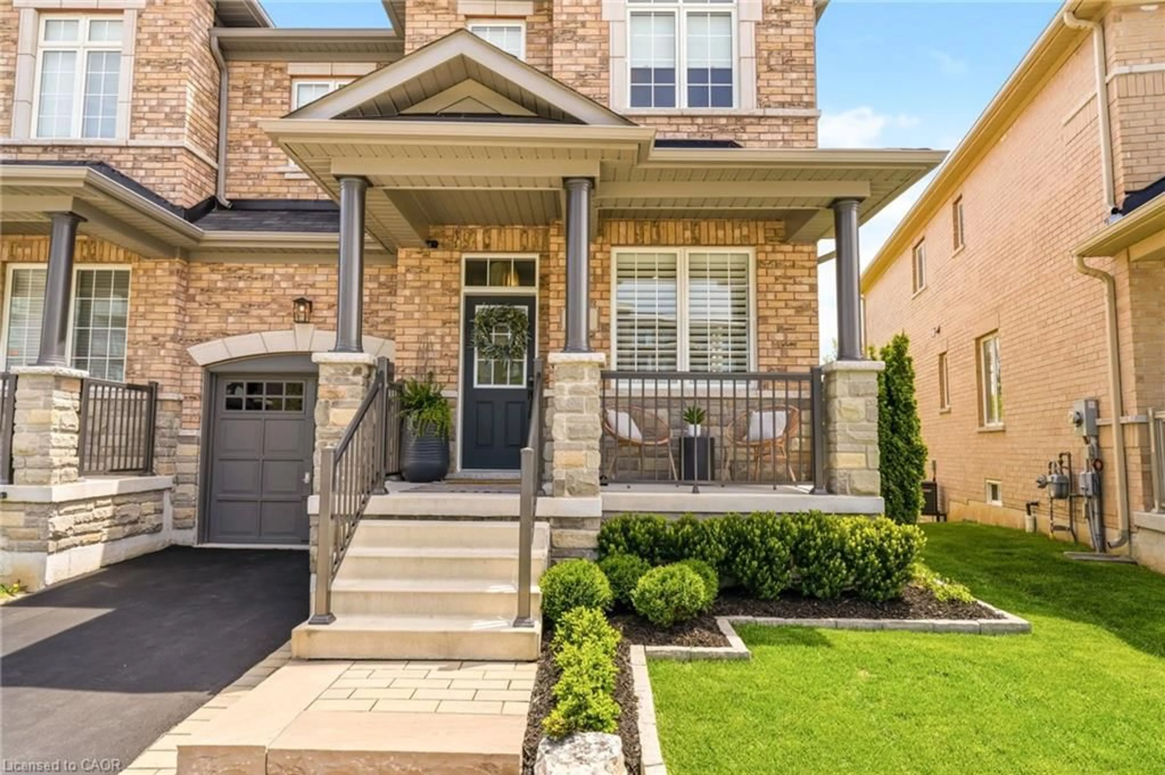Home with brick exterior material, street for 57 Riverwalk Dr, Waterdown Ontario L8B 1X3