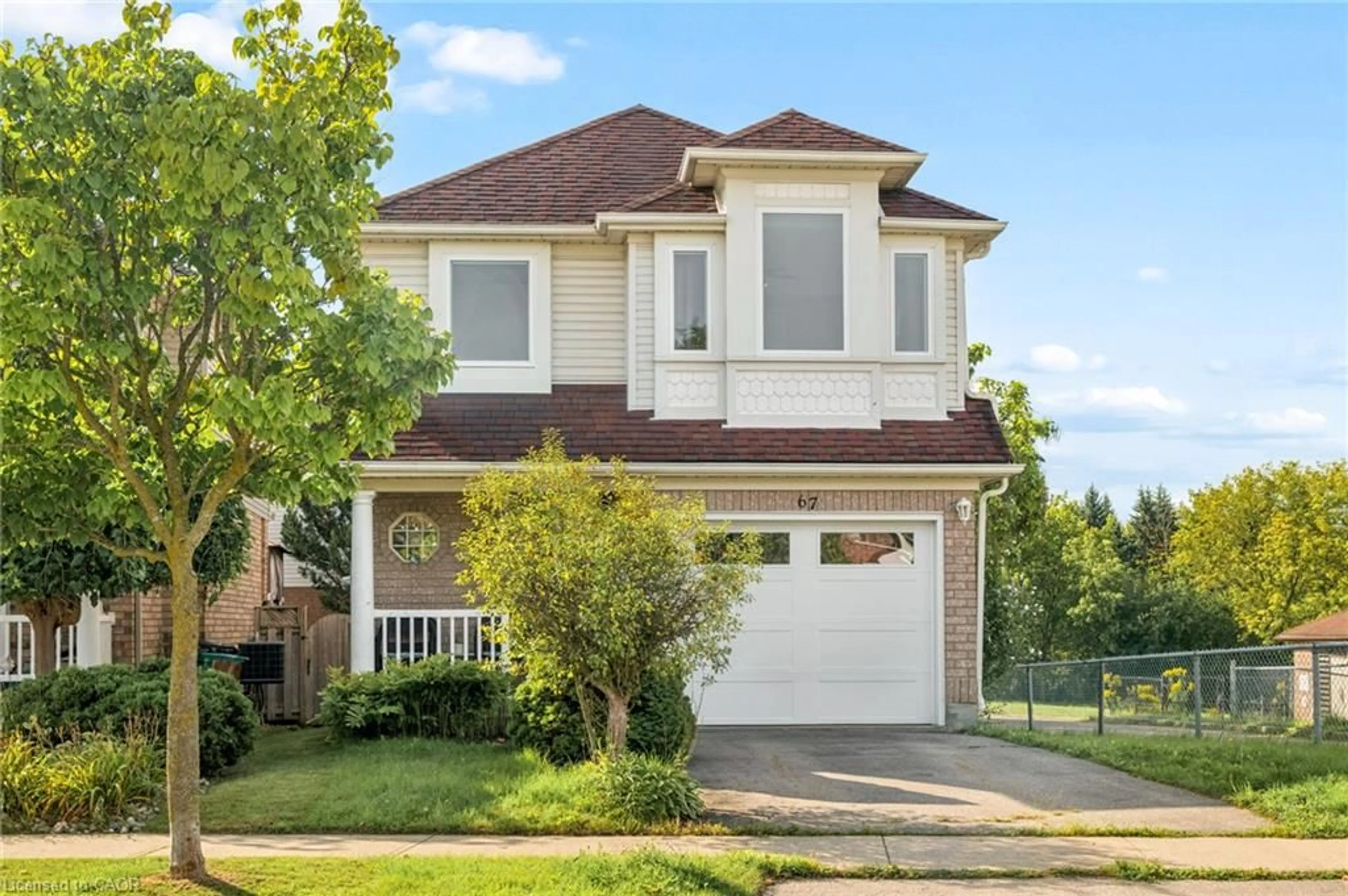 Home with vinyl exterior material, street for 67 Apple Tree Dr, Kitchener Ontario N2A 4C9