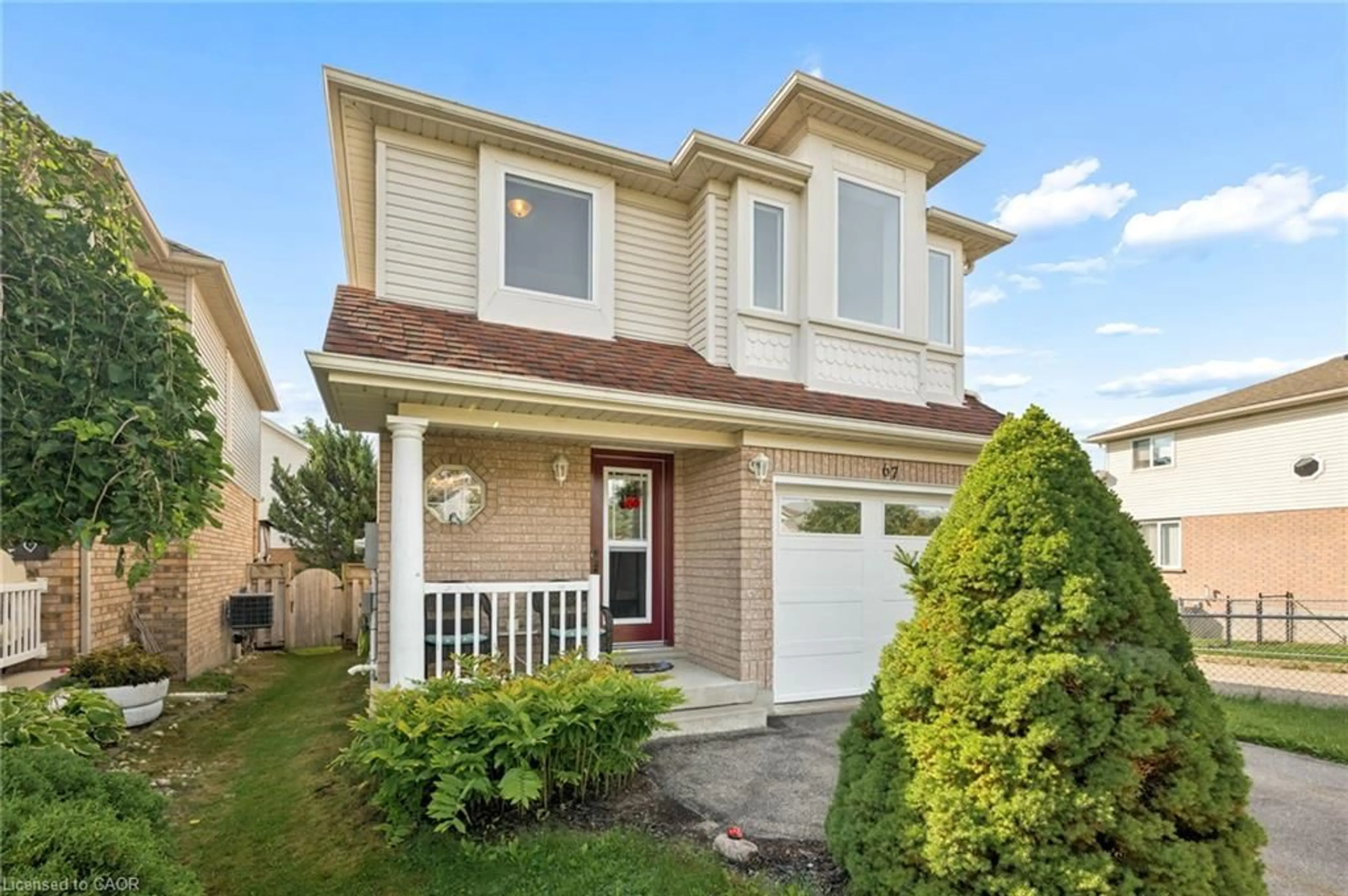 Home with vinyl exterior material, street for 67 Apple Tree Dr, Kitchener Ontario N2A 4C9