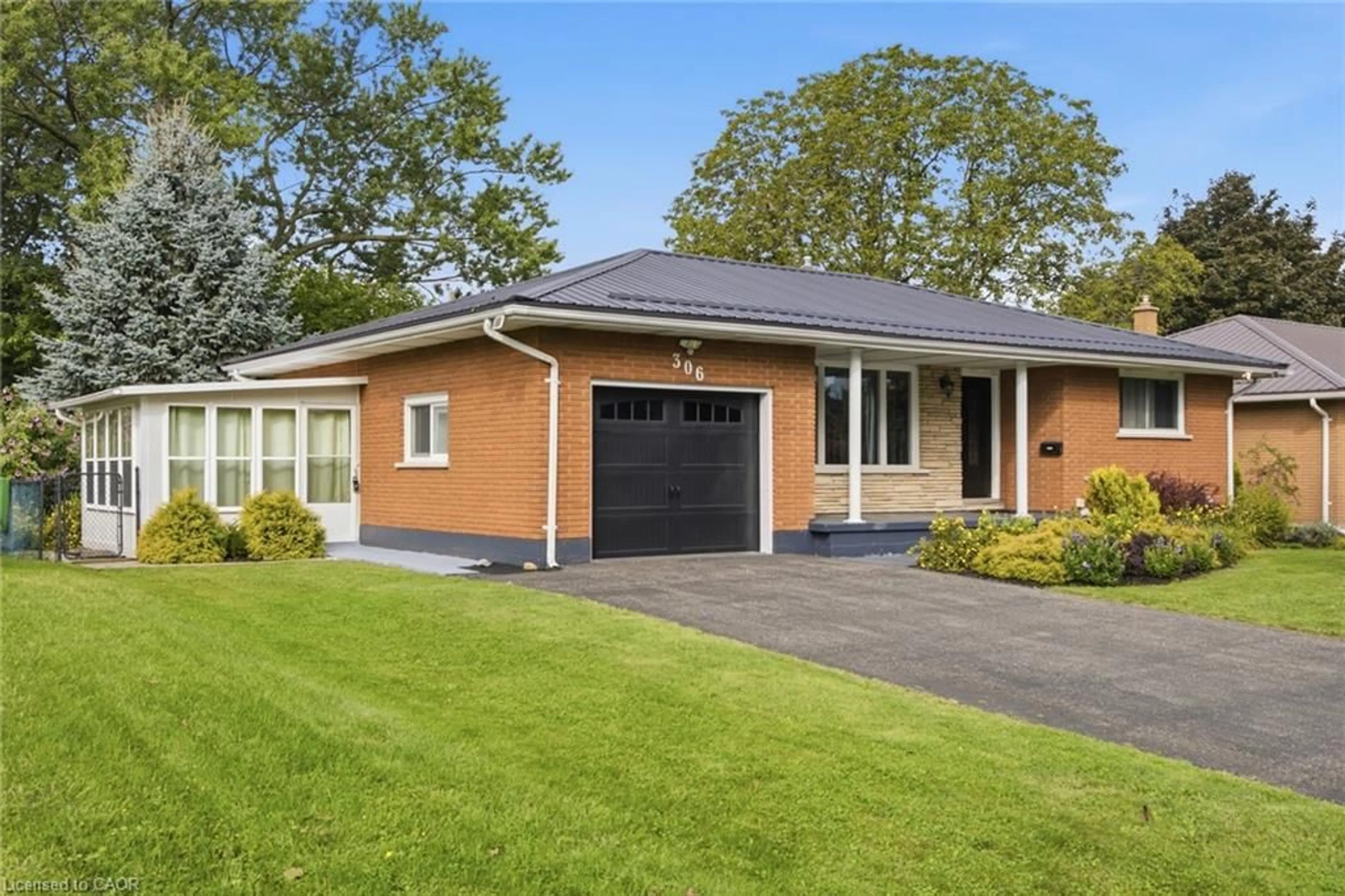 Home with brick exterior material, street for 306 Adams Ave, Delhi Ontario N4B 2Y5
