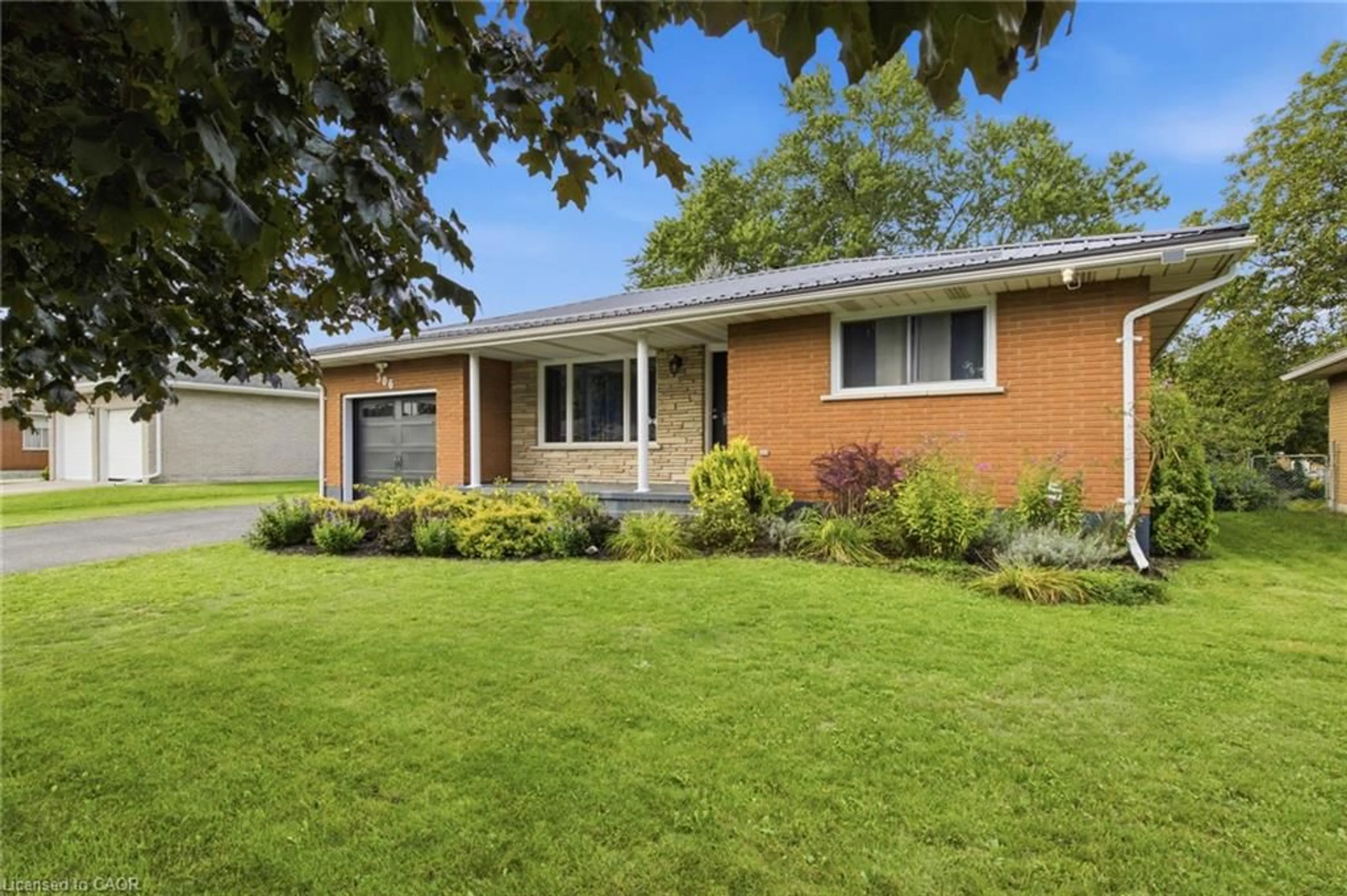 Home with brick exterior material, street for 306 Adams Ave, Delhi Ontario N4B 2Y5