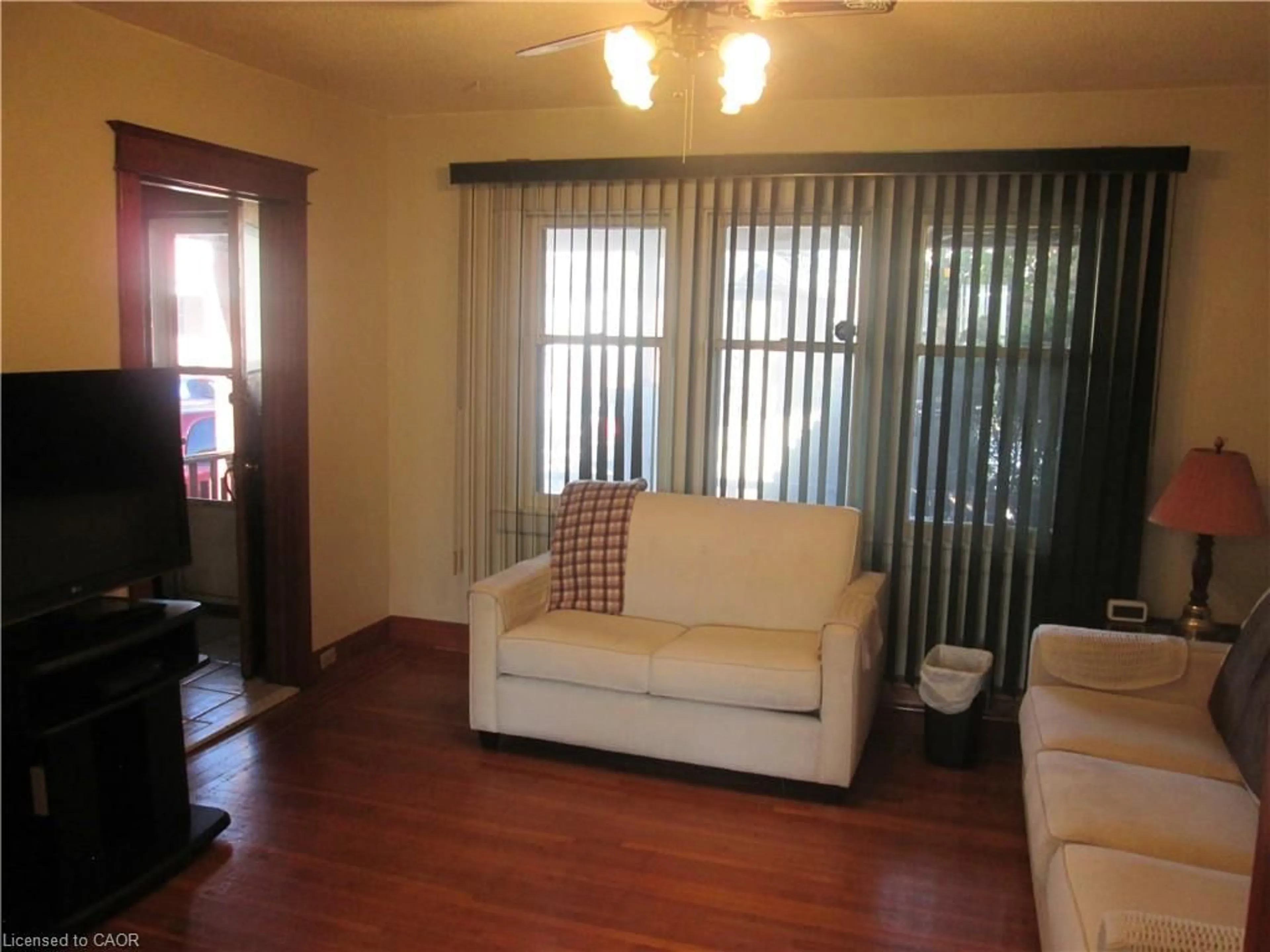 Living room with furniture, wood/laminate floor for 156 Leinster Ave, Hamilton Ontario L8L 6X9