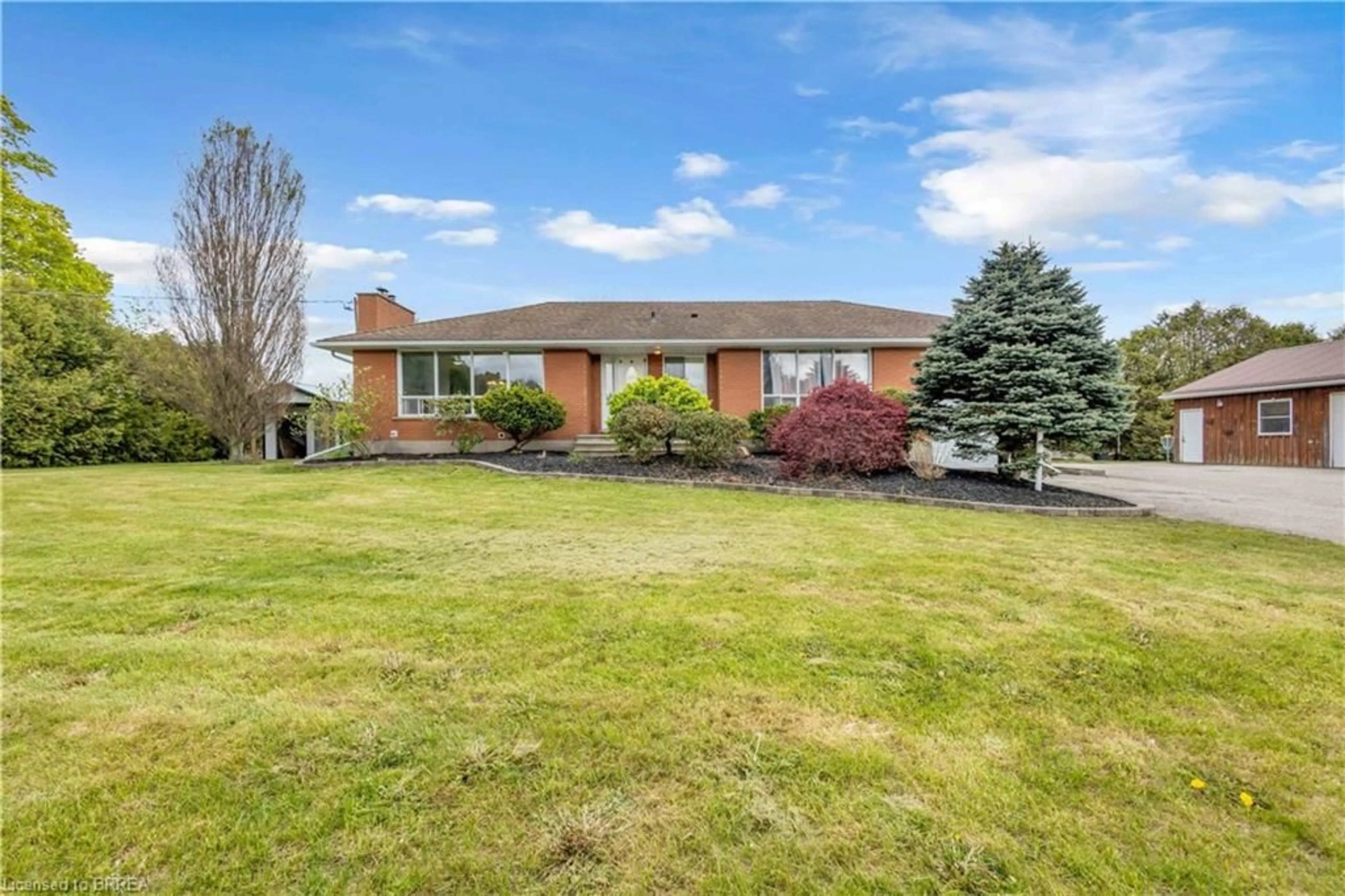 A pic from outside/outdoor area/front of a property/back of a property/a pic from drone, unknown for 348 Windham Rd 12 Rd, Simcoe Ontario N3Y 4K6