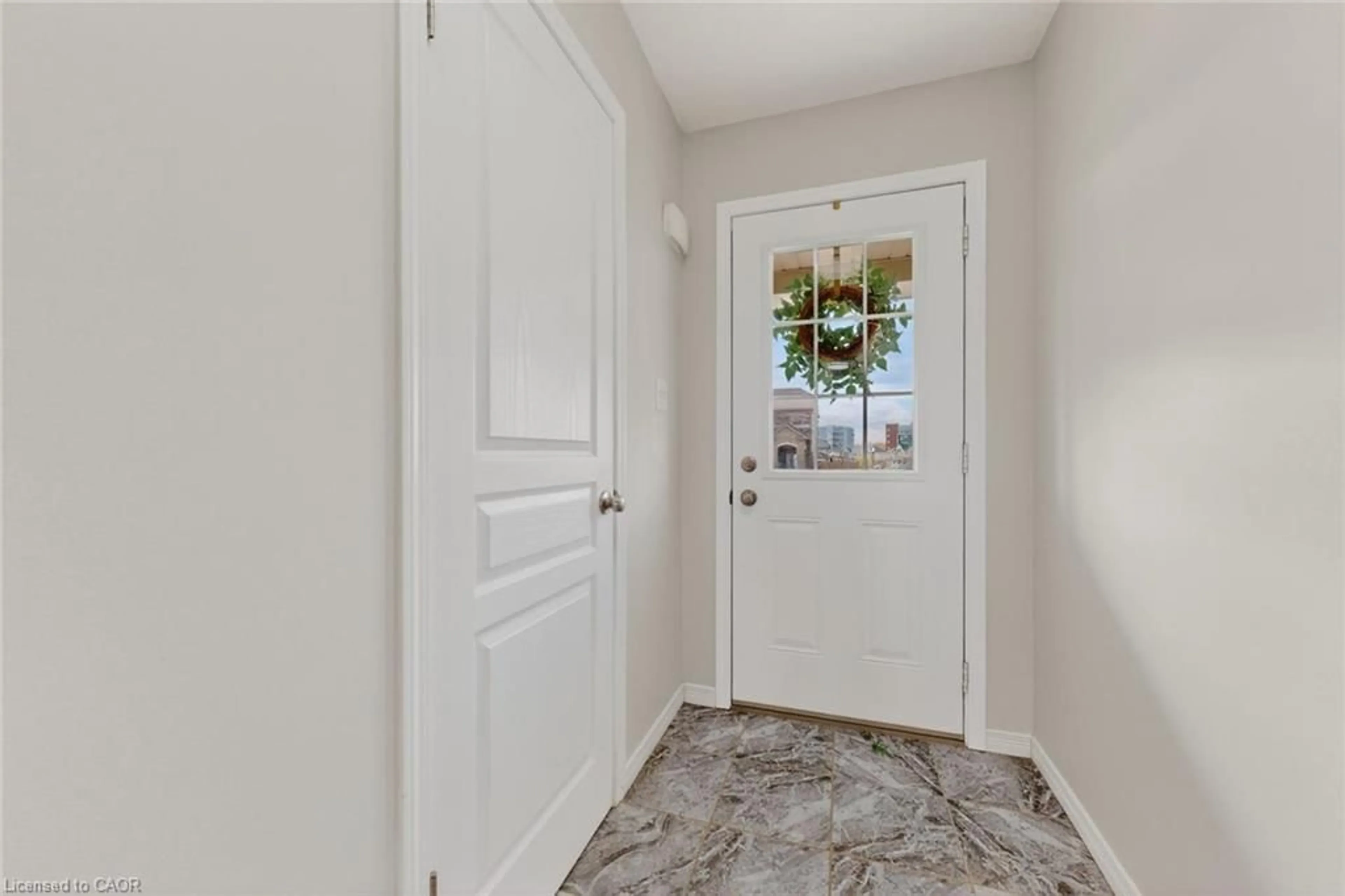 Indoor entryway for 73 Grand Flats Trail, Kitchener Ontario N2A 0H7