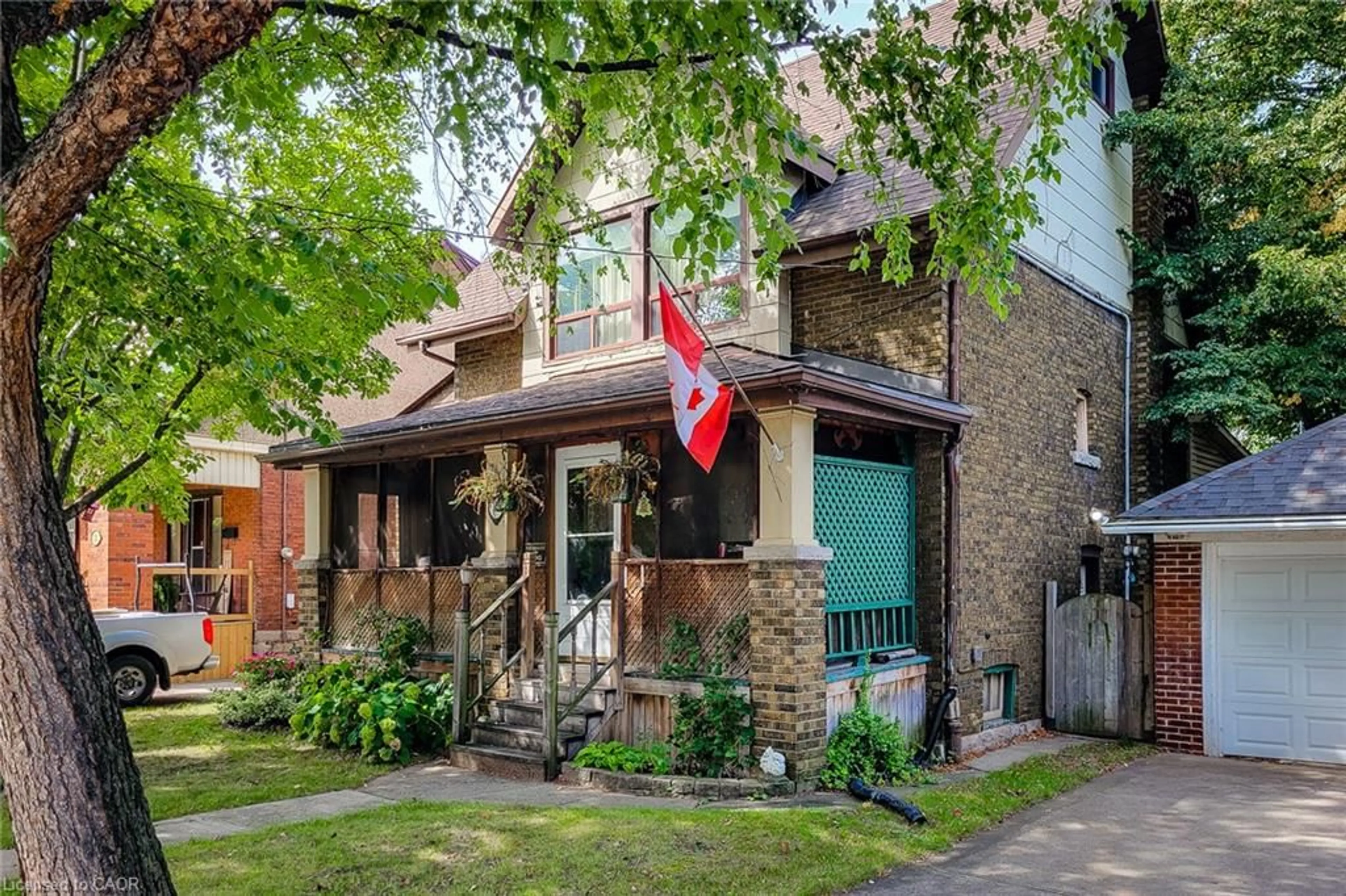 Home with brick exterior material, street for 12 Leinster Ave, Hamilton Ontario L8M 3A1