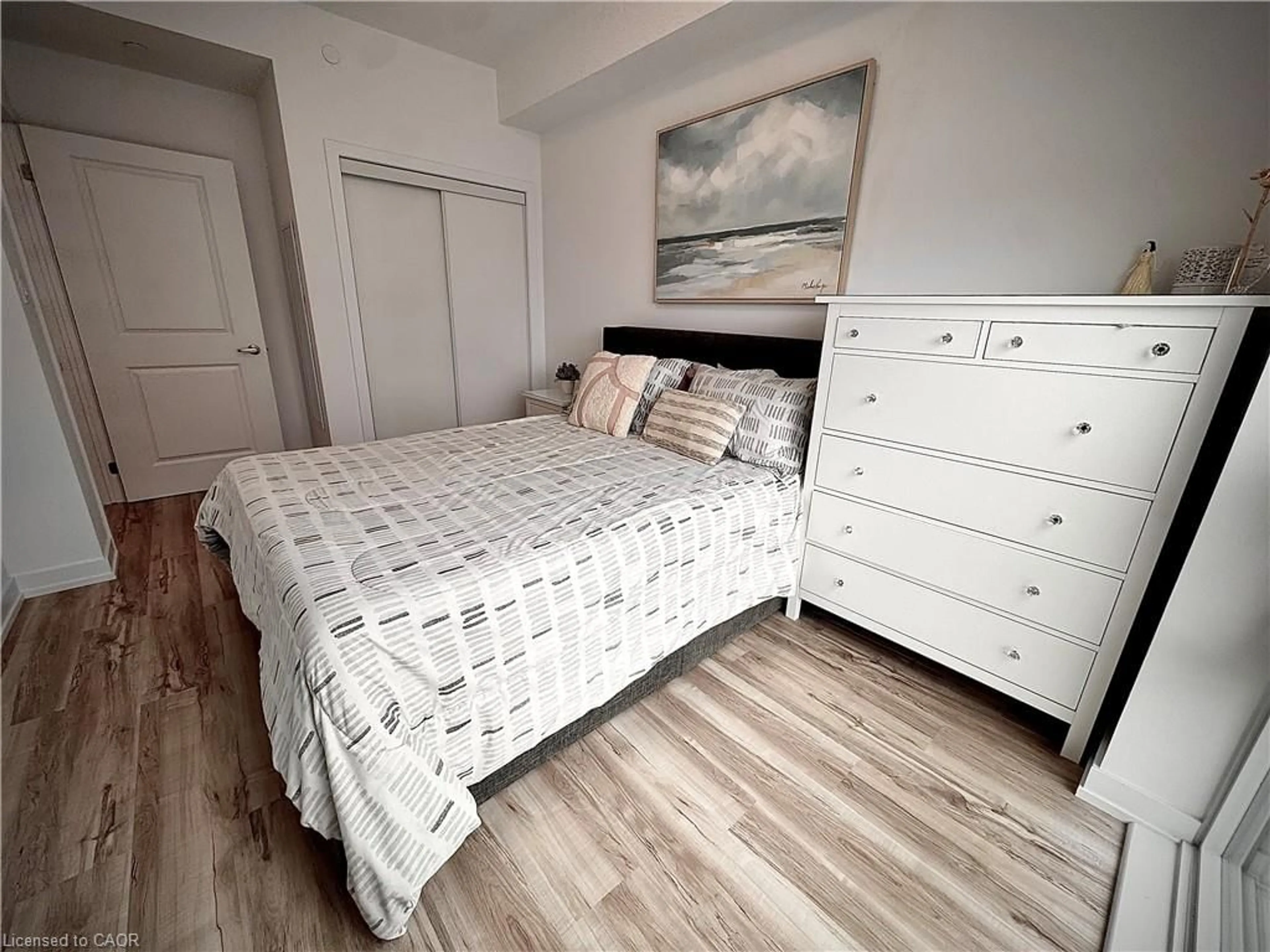 Bedroom with bed, wood/laminate floor for 460 Dundas St #709, Waterdown Ontario L8B 2A5