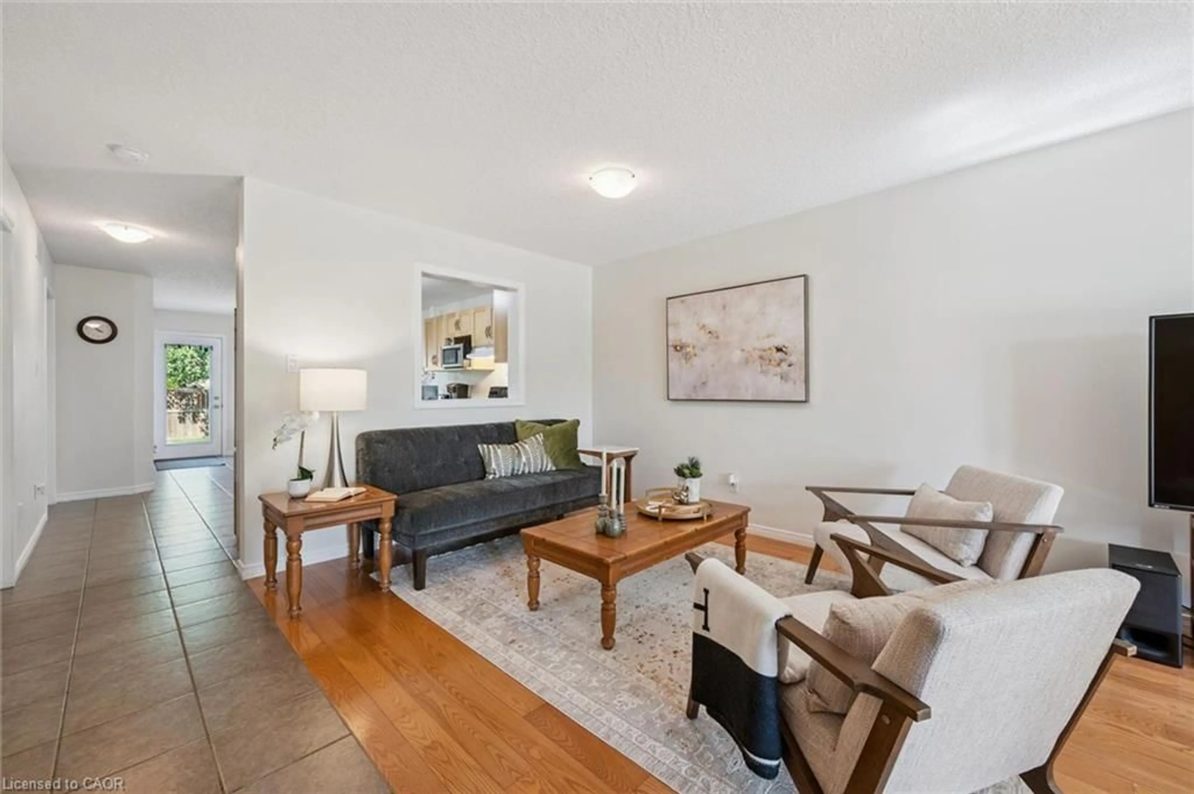 Living room with furniture, wood/laminate floor for 105 Spencer Dr, Elora Ontario N0B 1S0