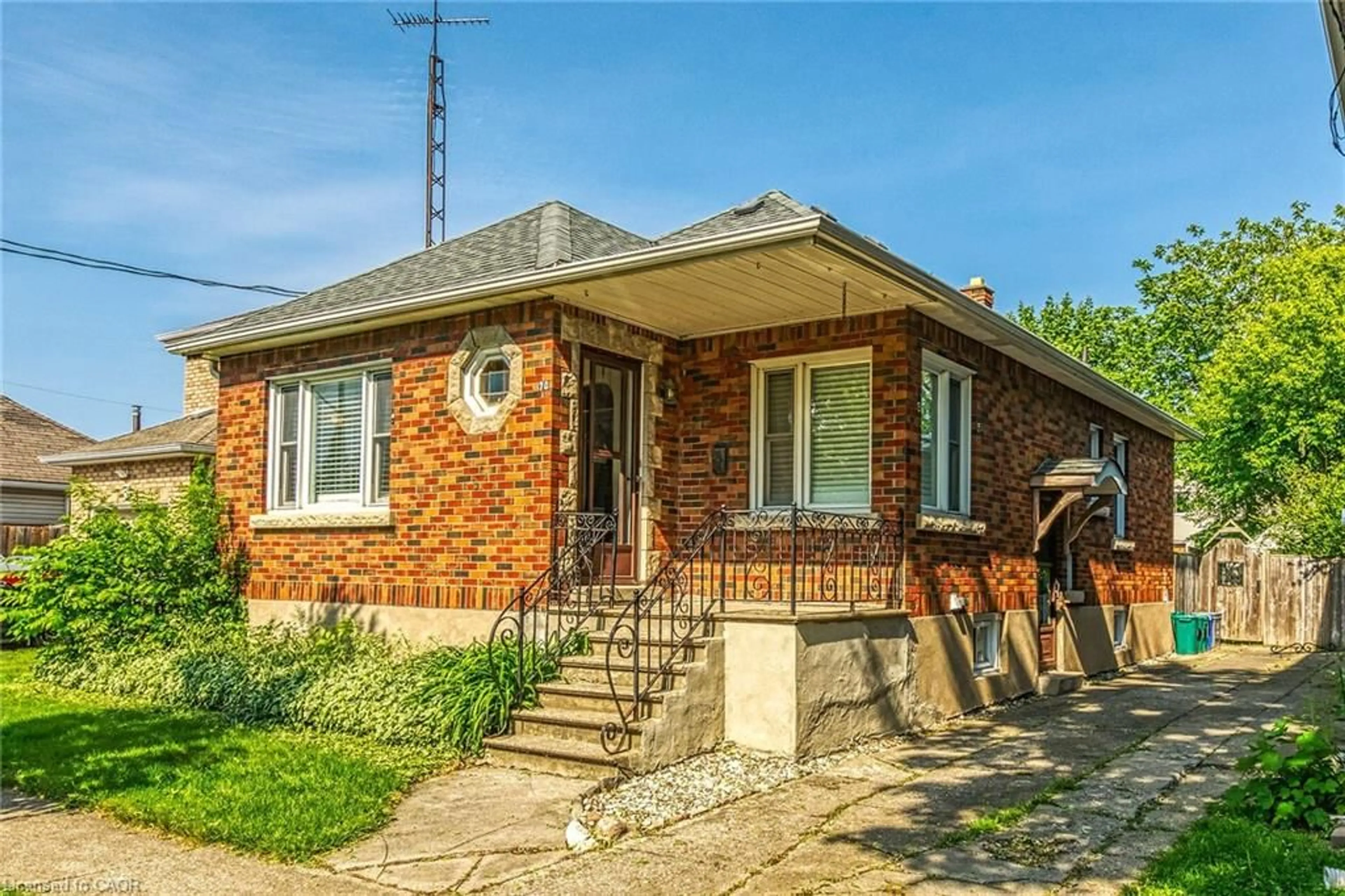 Home with brick exterior material, street for 70 Concord Ave, St. Catharines Ontario L2M 5N8