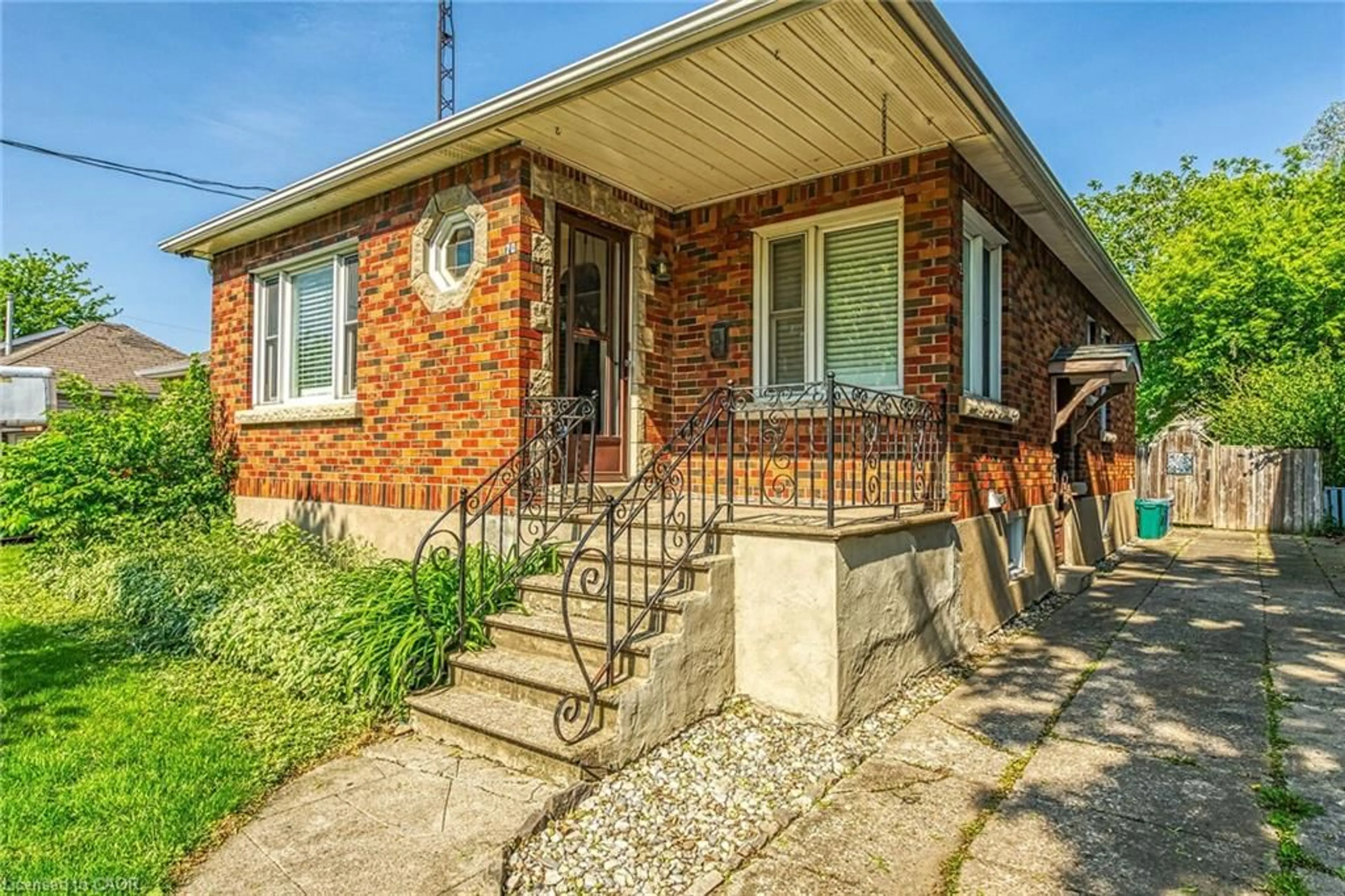Home with brick exterior material, street for 70 Concord Ave, St. Catharines Ontario L2M 5N8