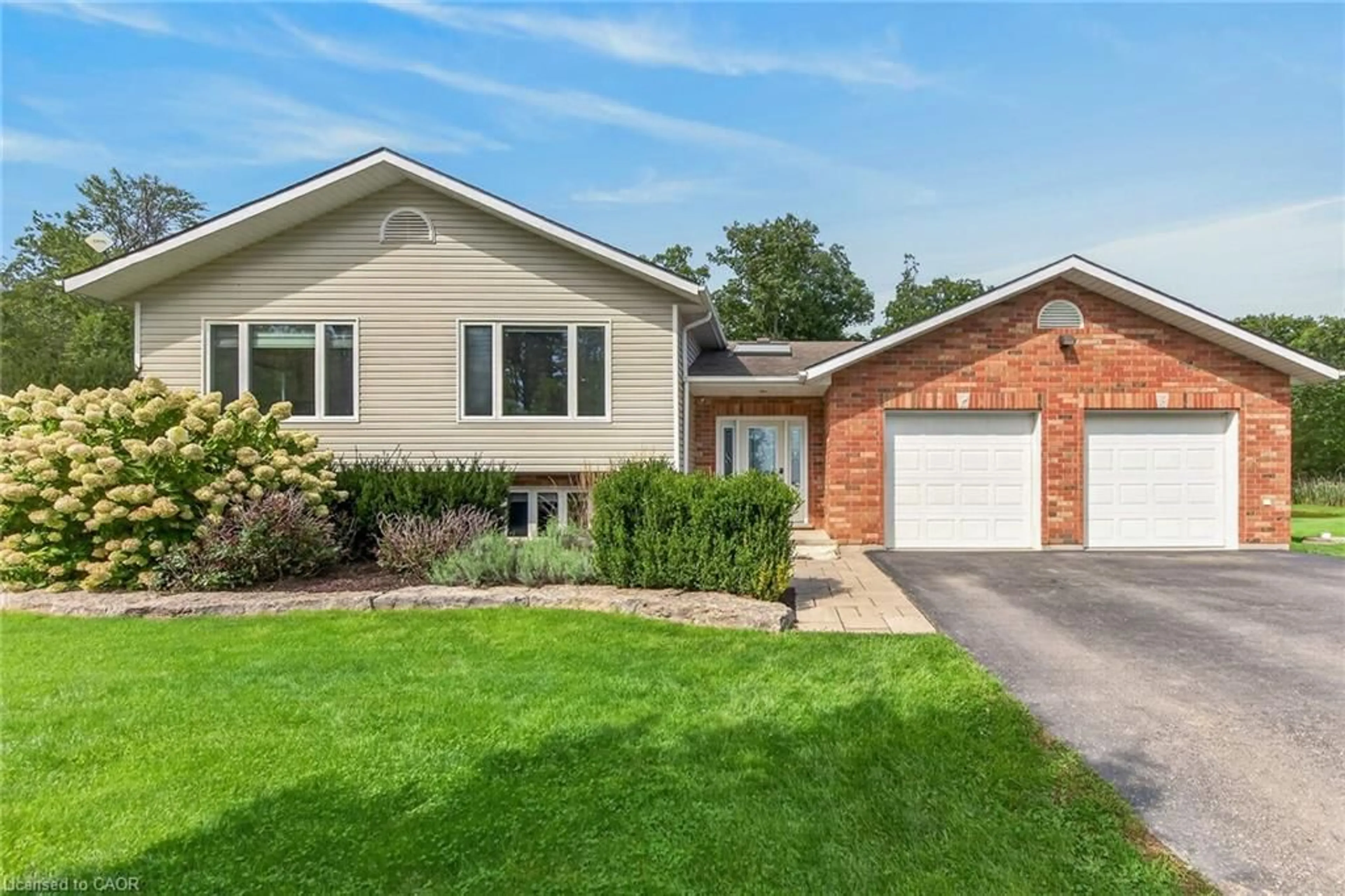 Home with vinyl exterior material, street for 695 Concession 1 Rd, Cayuga Ontario N0A 1E0