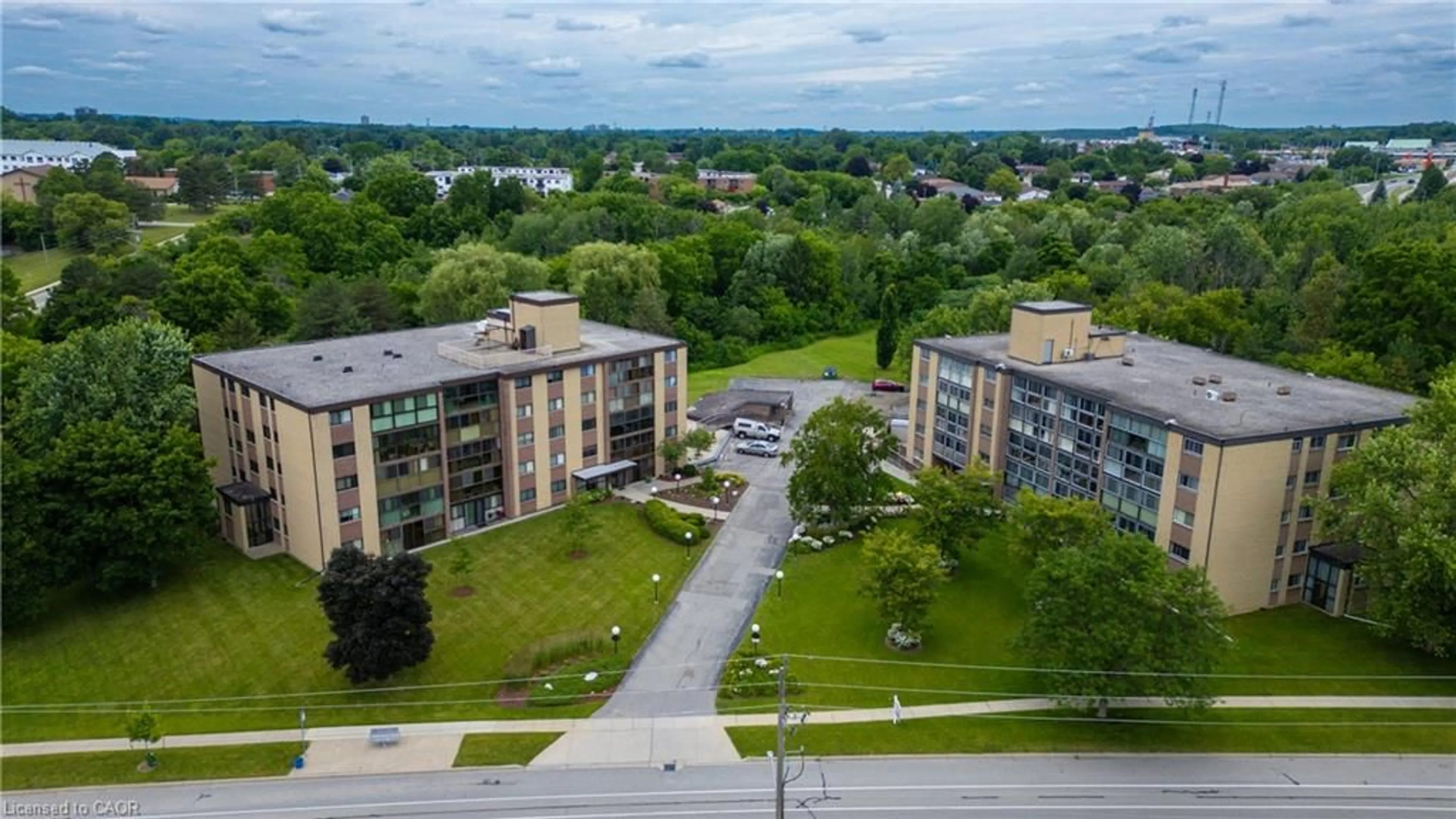 A pic from outside/outdoor area/front of a property/back of a property/a pic from drone, unknown for 380 Champlain Blvd #205, Cambridge Ontario N1R 7J6