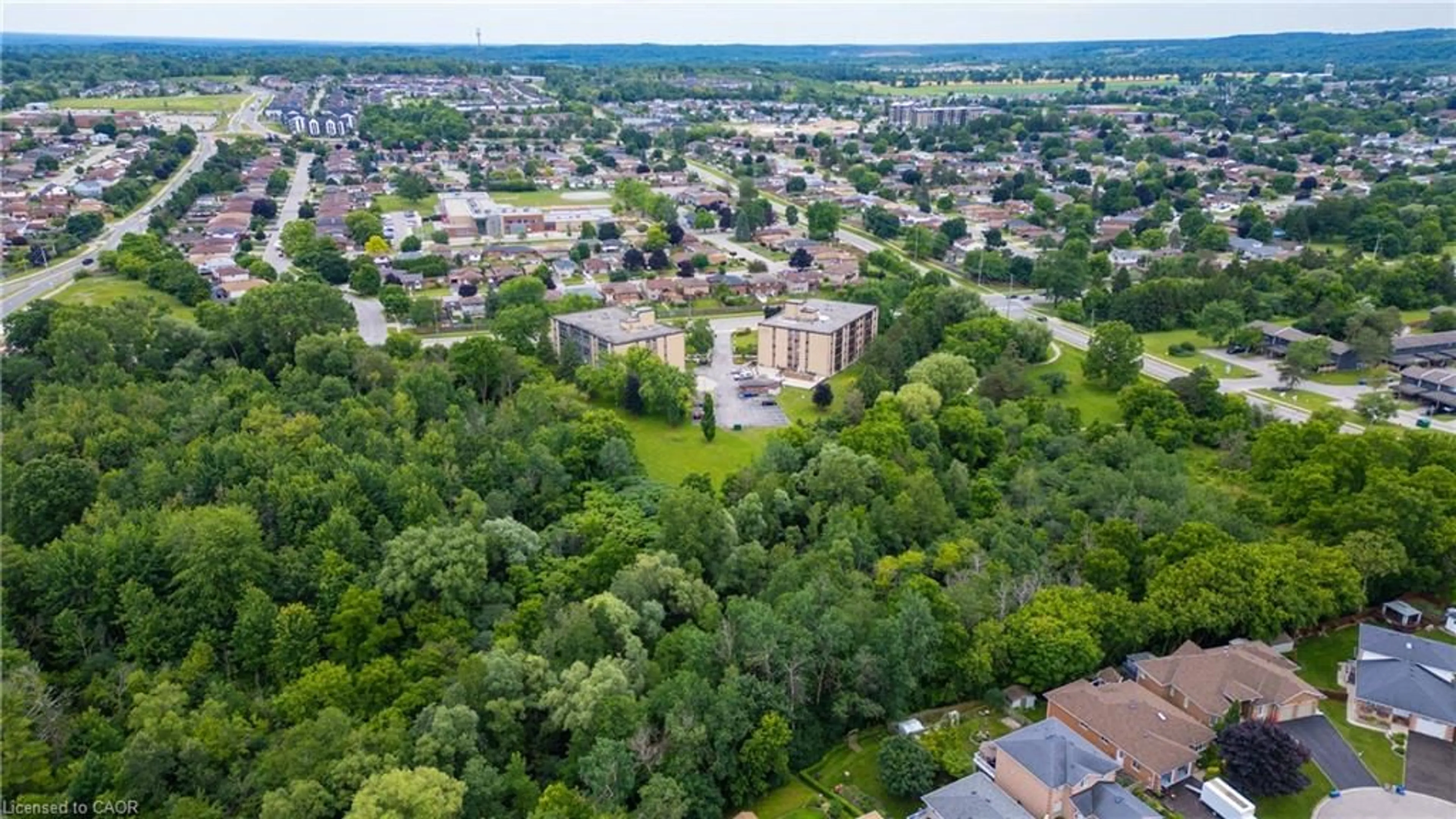 A pic from outside/outdoor area/front of a property/back of a property/a pic from drone, unknown for 380 Champlain Blvd #205, Cambridge Ontario N1R 7J6