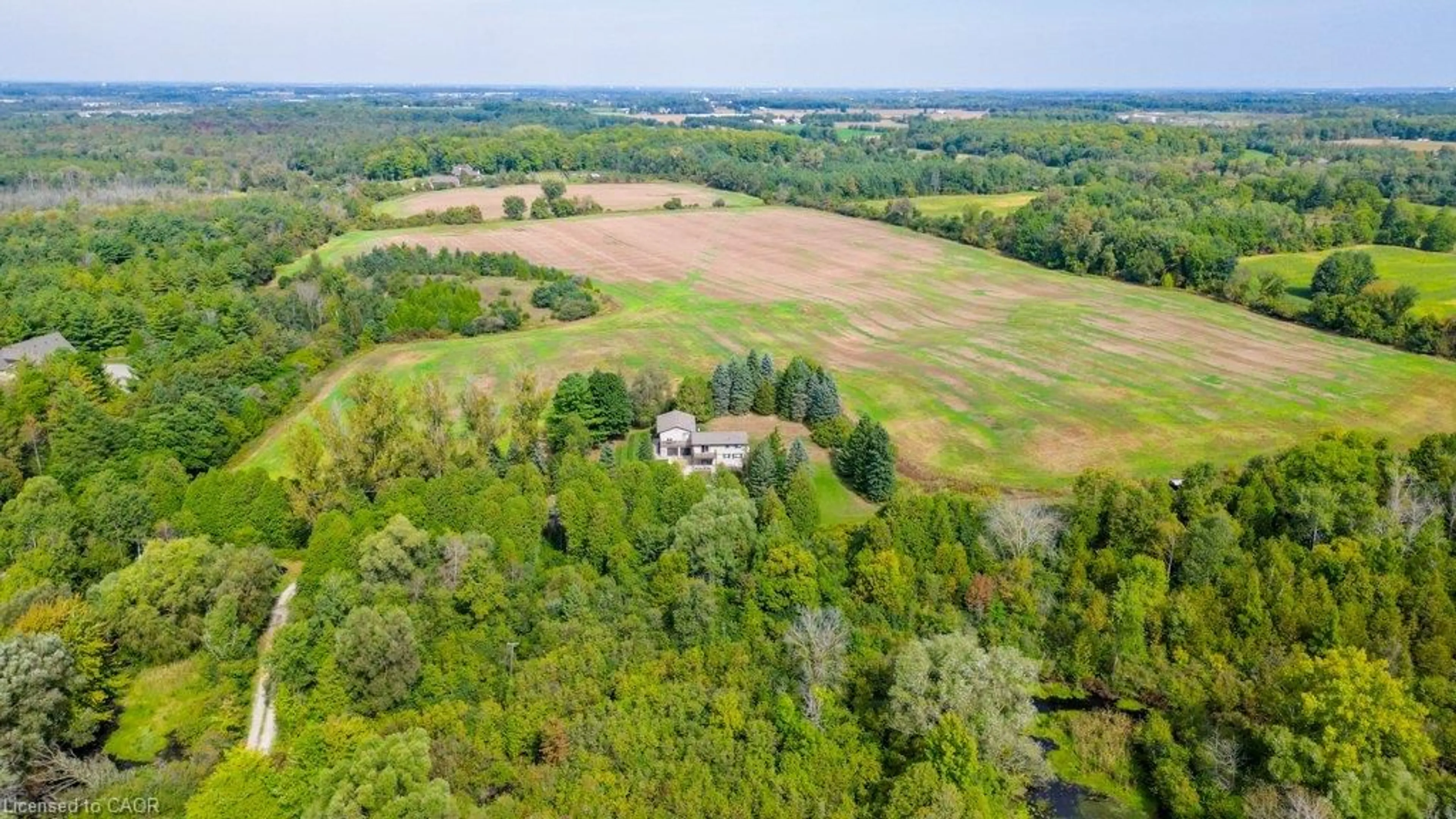 A pic from outside/outdoor area/front of a property/back of a property/a pic from drone, forest/trees view for 6542 Ellis Rd, Cambridge Ontario N3C 2V4