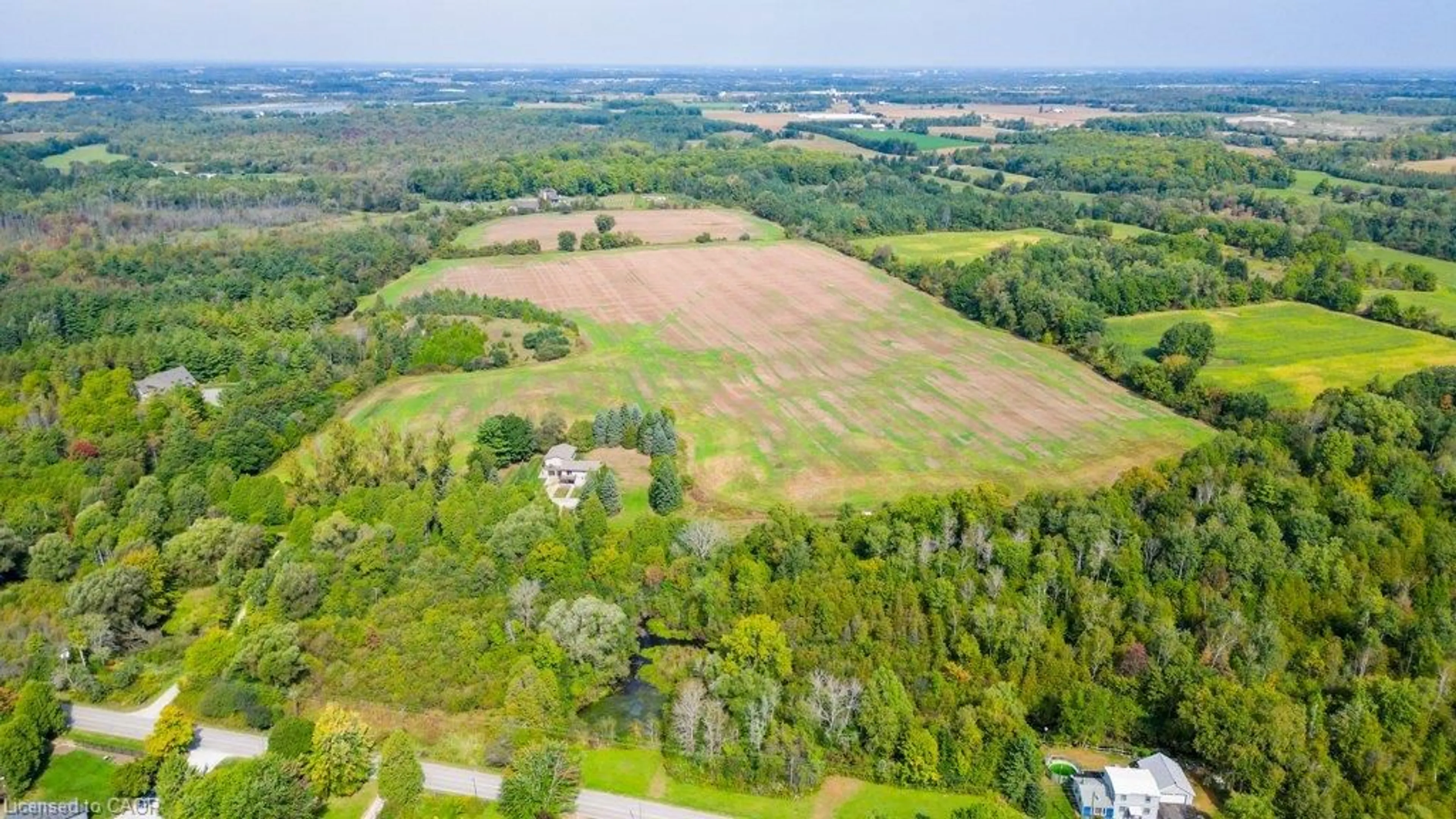 A pic from outside/outdoor area/front of a property/back of a property/a pic from drone, forest/trees view for 6542 Ellis Rd, Cambridge Ontario N3C 2V4