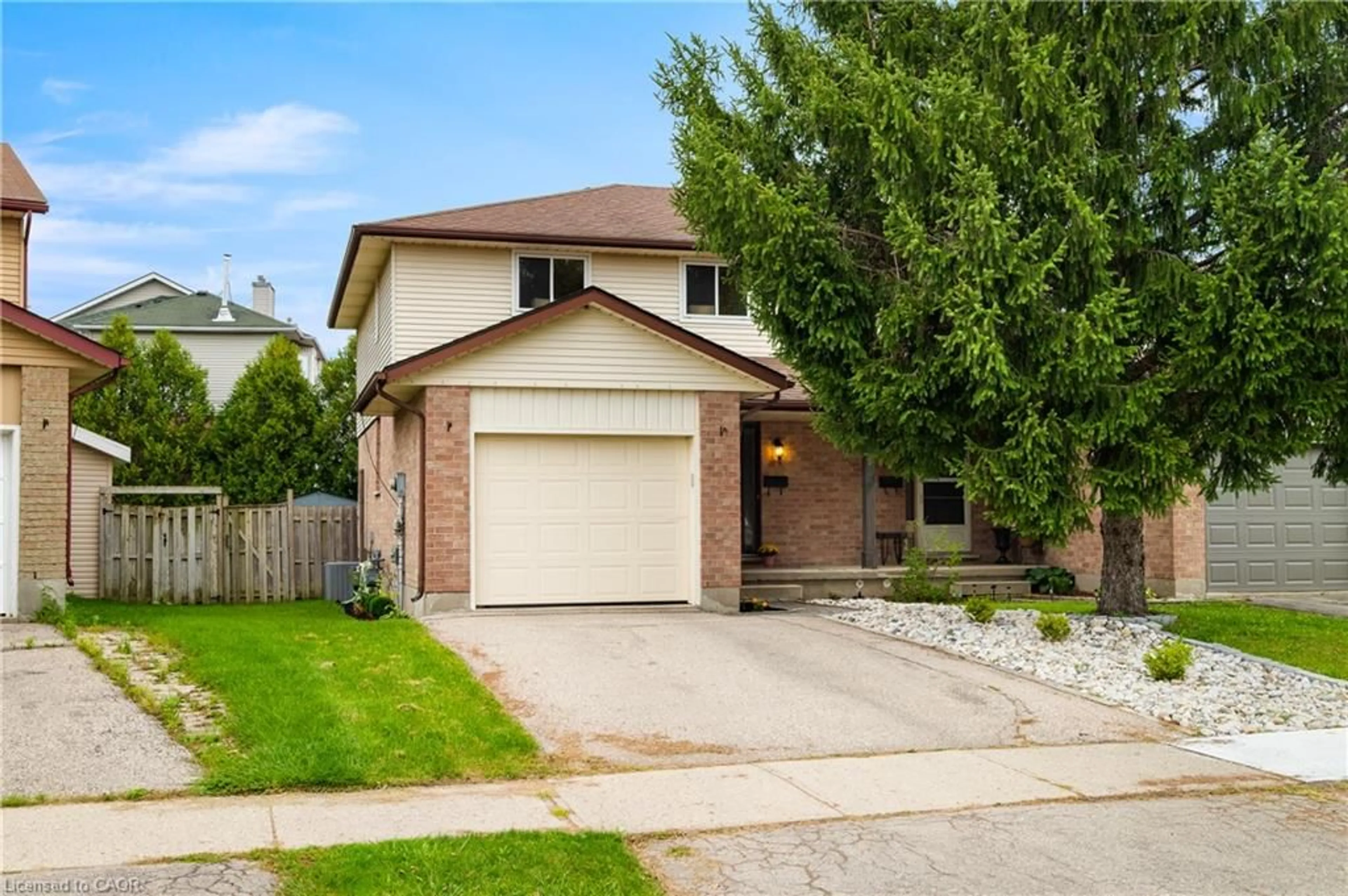 Home with brick exterior material, street for 647 Pinerow Cres #A, Waterloo Ontario N2T 2K5