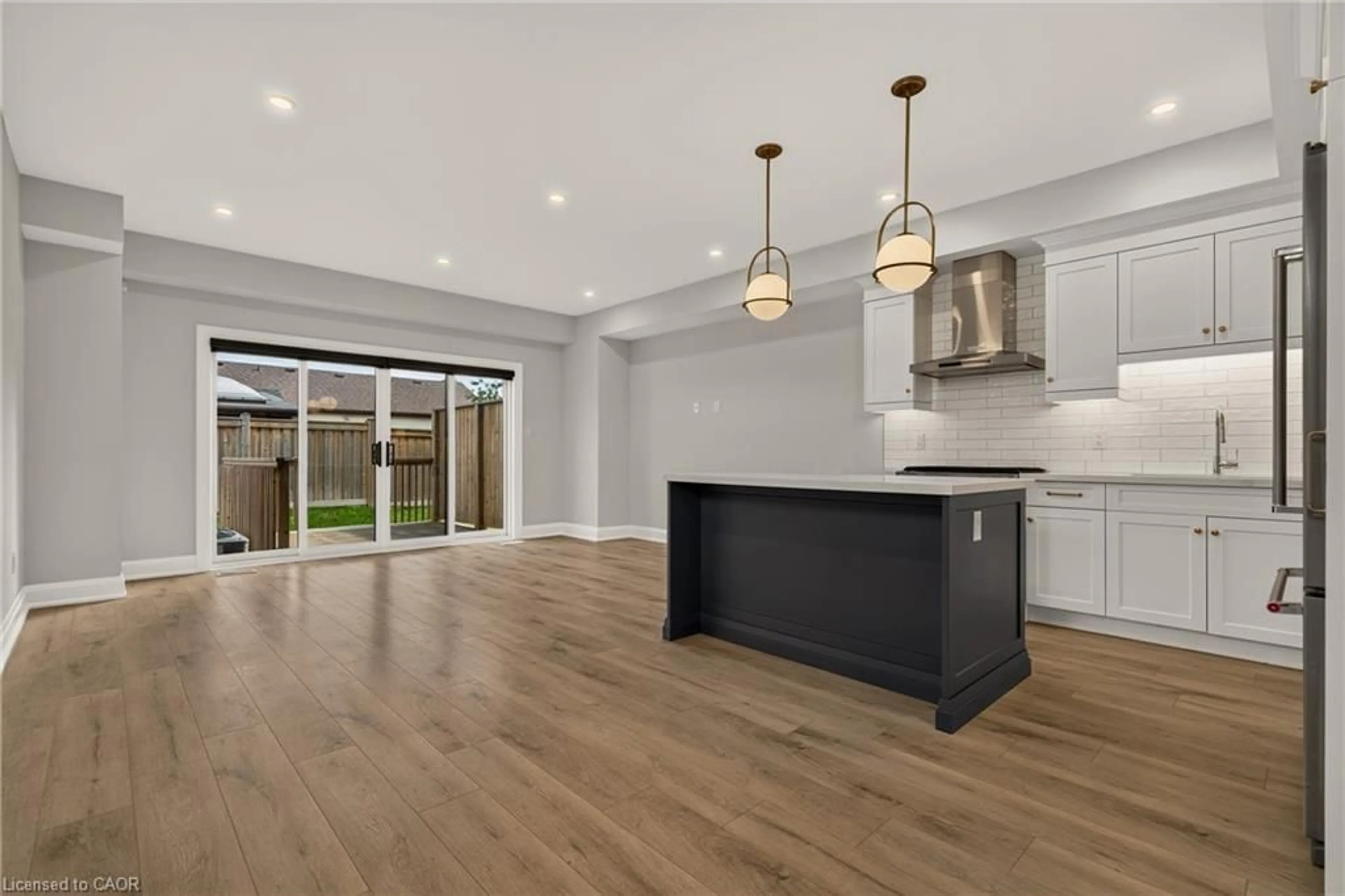 Open concept kitchen, wood/laminate floor for 118 Springvalley Cres, Hamilton Ontario L9C 0E4