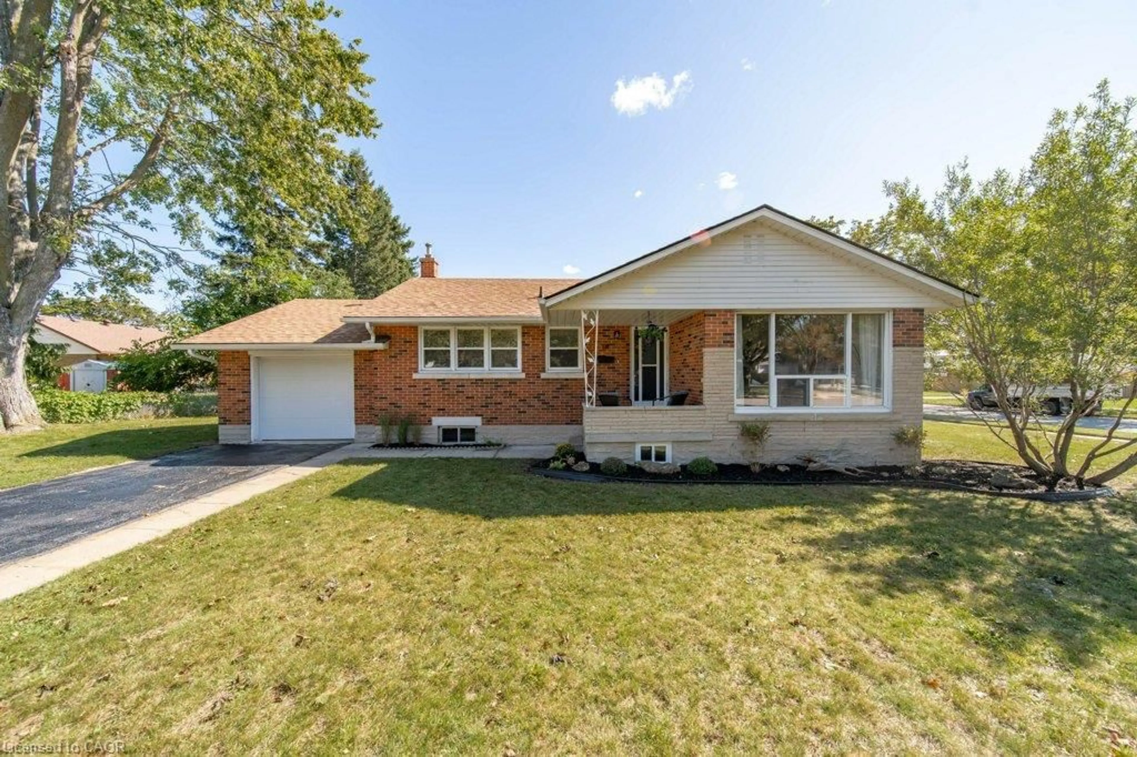Home with brick exterior material, street for 18 Maywood Rd, Kitchener Ontario N2C 2A3