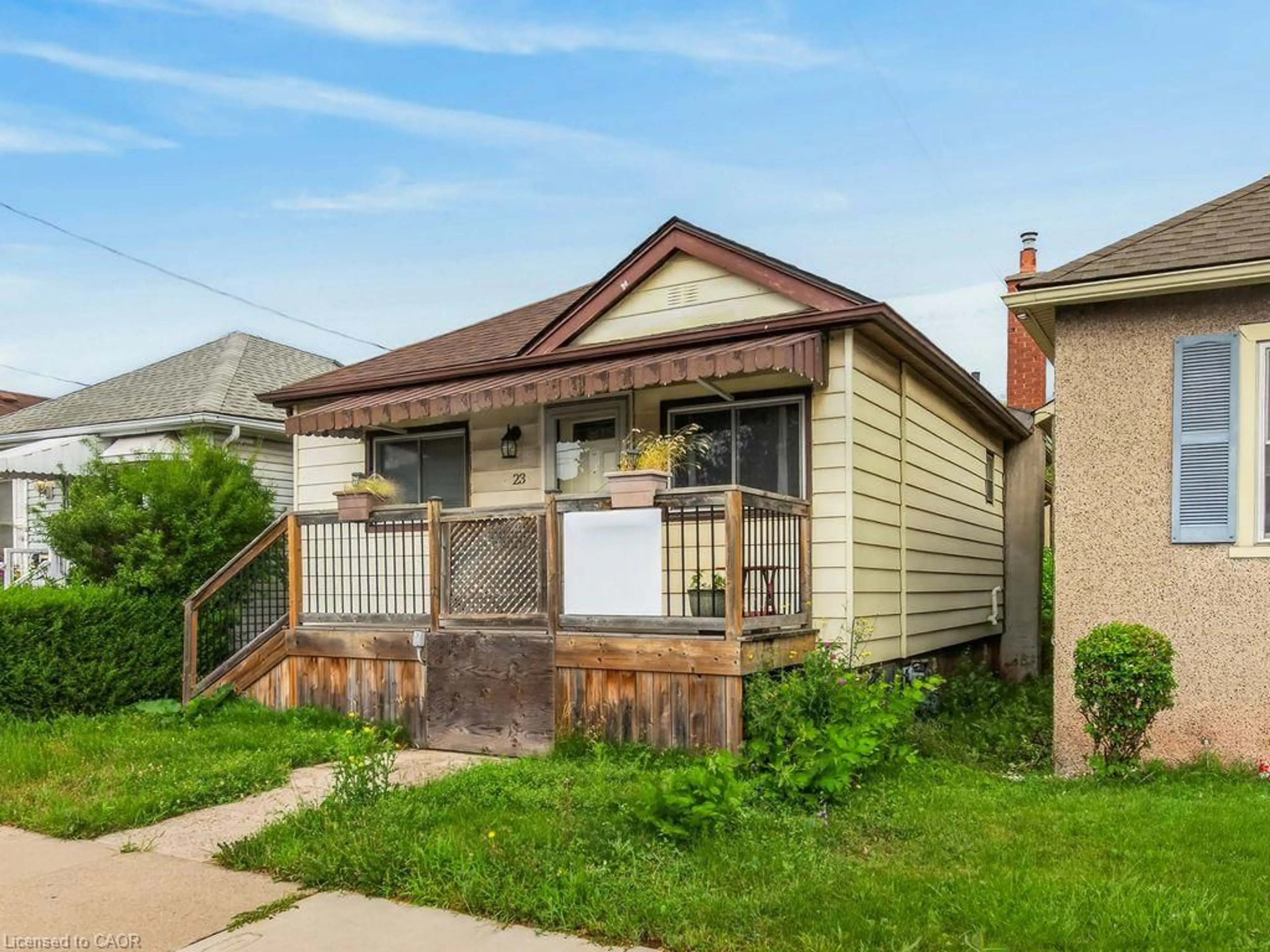 Home with vinyl exterior material, street for 23 Harrison Ave, Hamilton Ontario L8H 2Z8